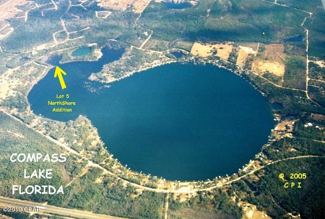 NO KIDDING  !!  A LAKEFRONT LOT with 144' on Beautiful Compass Lake for just $ 39,900. This lot is in the Northeast corner of Compass Lake allowing a Gorgeous Sunset view looking SouthWest across the Lake. Compass Lake is an approx. 700 Acre Lake that is the Premier Lake in North Florida for recreational use because of its Clean Clear Fresh Water. This lot is in the more shallow portion of Compass Lake which is Great for Fishing and allows access to the main deeper portion of the Lake for Skiing etc. This lot is one of only 6 lots fronting on Compass Lake that are a part of the Compass Lake in the Hills Subdivision, giving you access to all of their amenities. Opportunities like this one do not come along very often, ACT NOW to take ADVANTAGE of this GREAT OPPORTUNITY  !!