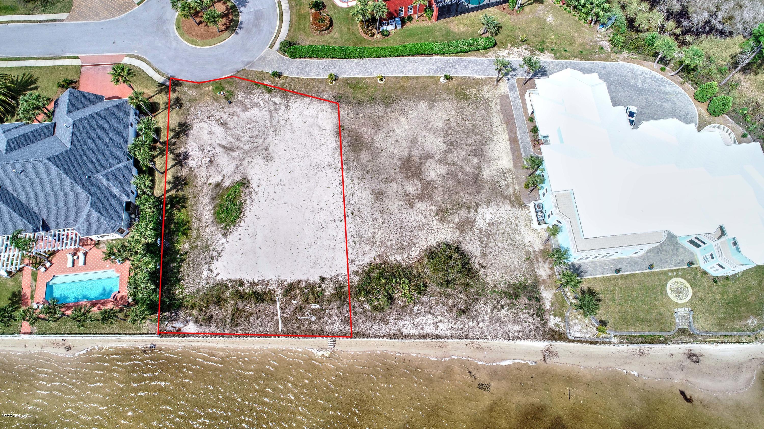 Welcome to Dolphin Bay. Enjoy dream views of St. Andrews Bay on this spacious bayfront lot. This gated subdivision is a family oriented, pet friendly community located only minutes away from the World's Most Beautiful Beaches as well as a private marina, tennis/pickleball/basketball court and picnic areas. The Harbourage Yacht Club is conveniently located in the community and offers 64 spacious boat slips with easy access to the bay and Gulf of Mexico. Buyer should verify measurements and information.