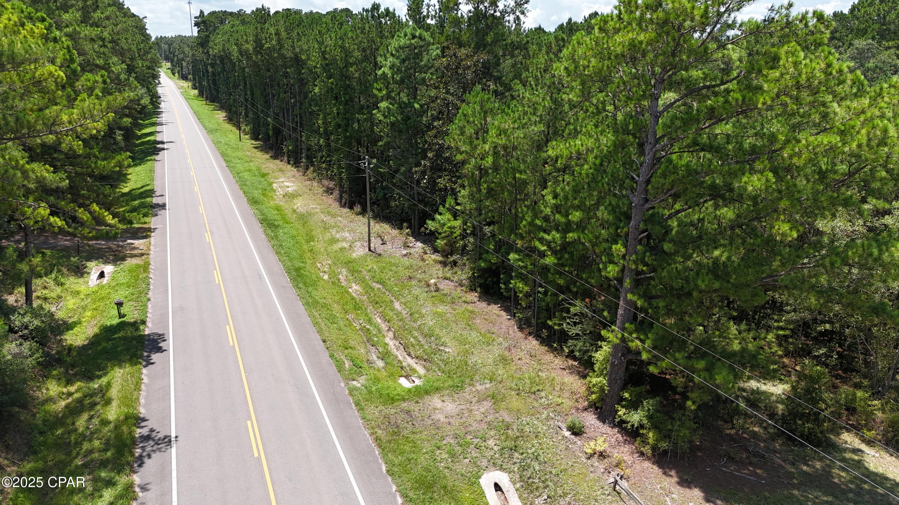 This 1.07-acre wooded lot in Bonifay, Florida, is a fantastic opportunity for anyone seeking a serene escape close to nature. With highway frontage on Highway 79, it's easily accessible while still providing a private and tranquil setting. The proximity to Wayside Park Creek is perfect for outdoor enthusiasts, offering excellent opportunities for swimming and fishing. Plus, you're just a short drive from both Dothan, Alabama, and the breathtaking beaches of Panama City, making this location a wonderful balance between convenience and natural beauty. This property is ideal for creating your dream retreat or investment!