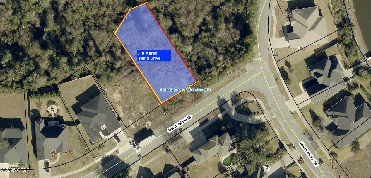Vacant residential lot in the Meadows.   Lot is irregular and slopes to the creek.  The Meadows is an upscale neighbourhood. Neighborhood has a homeowners association.  Home  and floor plan must be approved by the HOA ARB.   New buyer fee due at closing.  Buyer to verify dimensions and HOA dues.