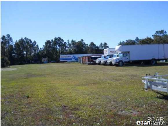 THIS GREAT PIECE OF PROPERTY CONSISTS OF 1.6 ACRES plus or minus depends on final survey . water /sewer on site, rail access available, fenced in w/ 6ft chain link. this property may be leased or owner fianced bring all offers.