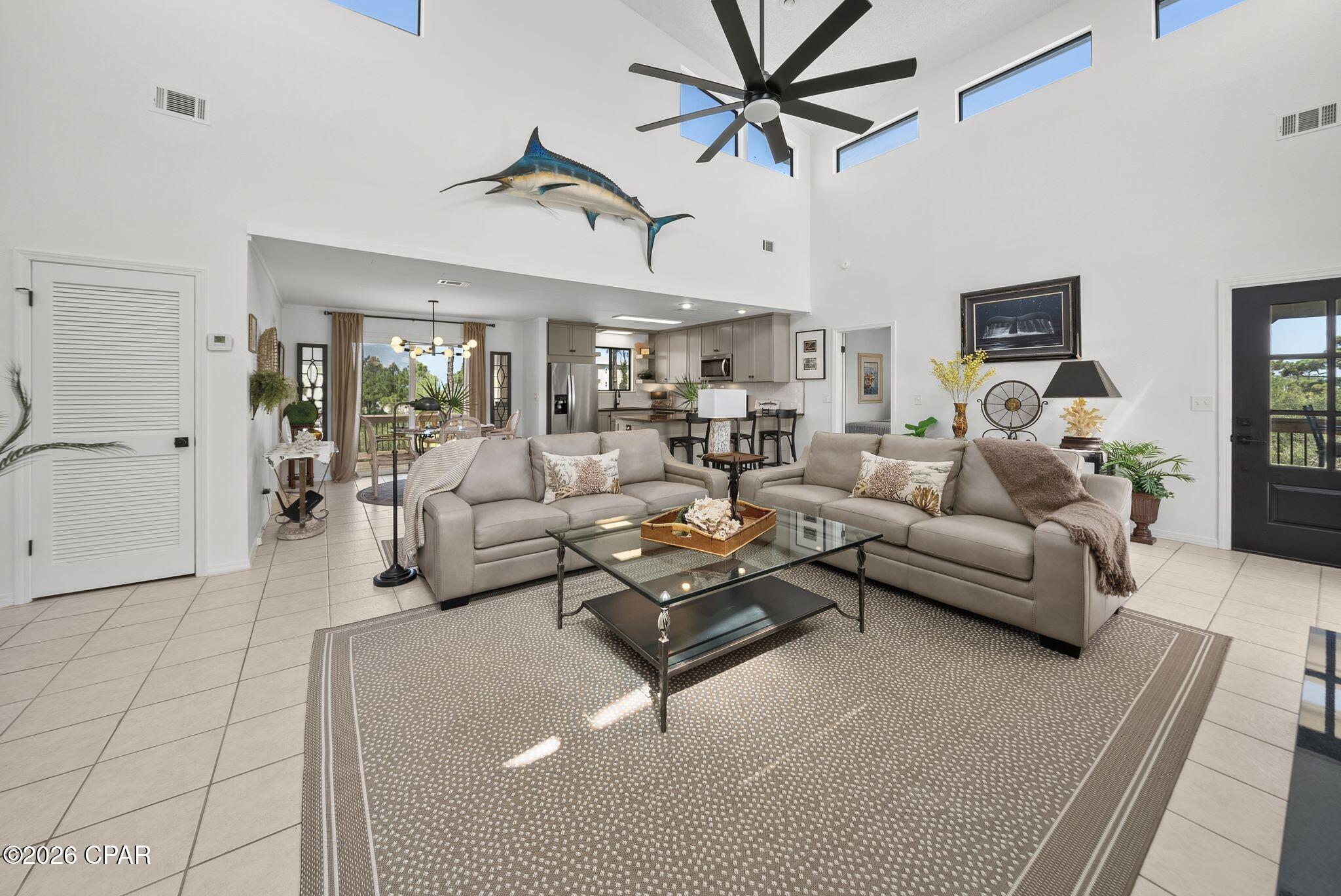 Experience luxury coastal living in this beautifully appointed first-tier bay home overlooking the crystal-clear waters of St. Joseph Bay in the highly desirable North Cape San Blas community. This exceptional residence comfortably sleeps nine and offers three beds, two bedrooms, two full baths, upscale finishes, and convenient access to both the bay and the Gulf, making it an outstanding primary residence, vacation retreat, or investment property. Rental projections are between $65,000 - $80,000 for short term rentals.

Inside, soaring vaulted ceilings and an open-concept design create a bright, spacious living area filled with natural light. Tile flooring extends throughout, while a beautiful gas fireplace provides the perfect gathering space after a day on the water. The gourmet kitchen features granite countertops, custom cabinetry, premium stainless steel appliances, a large pantry, and generous prep space for entertaining. The spacious primary suite opens directly onto a screened porch, creating a peaceful retreat to enjoy your morning coffee. The luxurious ensuite bath includes dual vanities and a beautifully tiled walk-in shower. The guest bedroom also offers direct access to the expansive outdoor living areas. 

Designed for the coastal lifestyle, the home boasts massive new front and rear decks that provide exceptional space for outdoor dining, entertaining, and taking in breathtaking sunsets over the bay. An outdoor shower makes cleanup after a day at the beach or on the boat effortless. Built on extra-tall pilings, the home offers abundant covered parking and storage for a boat, RV, multiple vehicles, and all your fishing and beach gear. Owners enjoy access to a PRIVATE COMMUNITY DOCK on St. Joseph Bay for boating, fishing, kayaking, and paddleboarding, while Gulf beach access is just a short walk away across the street from the entrance to the road to the property. Mature native vegetation provides outstanding privacy, and the home offers excellent rental potential. 

An additional roadside lot is also available for purchase.