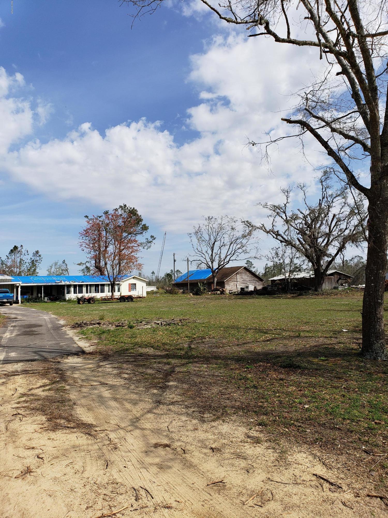 large tract of land with a beautiful pond toward the back. this tract has a home on it that was damaged by the storm. the listing price doesn't show any value for the house.  the land is a charming tract with lots of potential. there are additional tracts to be purchased or combined with this to make a very nice private piece of land for your new home!