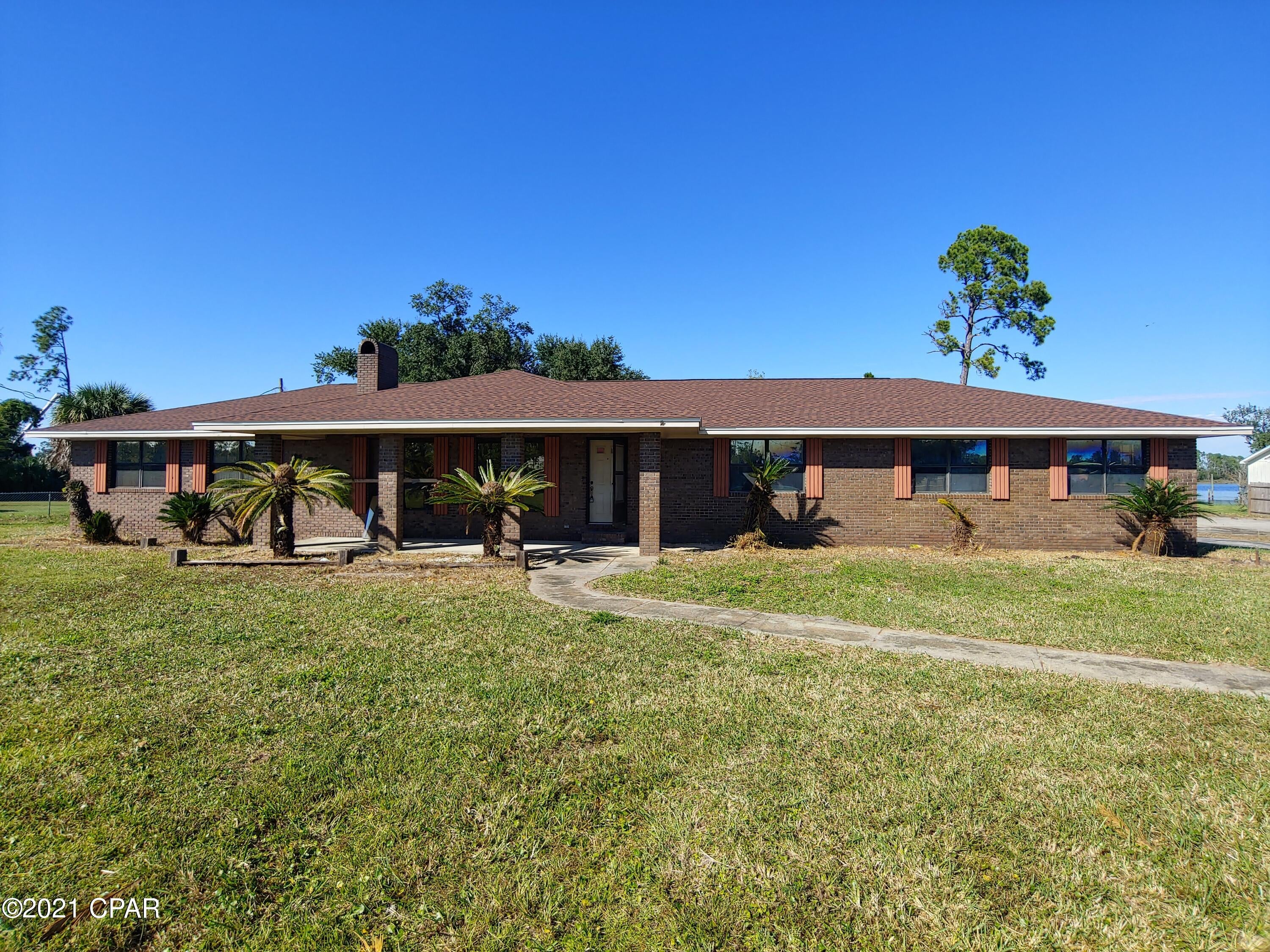 Gulf Access from your waterfront property on Fanning Bayou. This Brick home sits on over an acre! Solid home with framed interior needs finishing and is ready for your customizations, with open living area and views of the water. 

Room for all your toys and a place to build your pole barn or detached garage. Boathouse, Lift, and Dock need work but are present. Quiet area in fast growing Southport.  

Other home features include wood burning fireplace, converted garage for extra room,  hurricane roof clips, permitted roof, covered front porch, and large slab for storage building . Plenty of room for turnaround driveway.



Features, dimensions, uses are all approximate, to be verified by buyer if important.