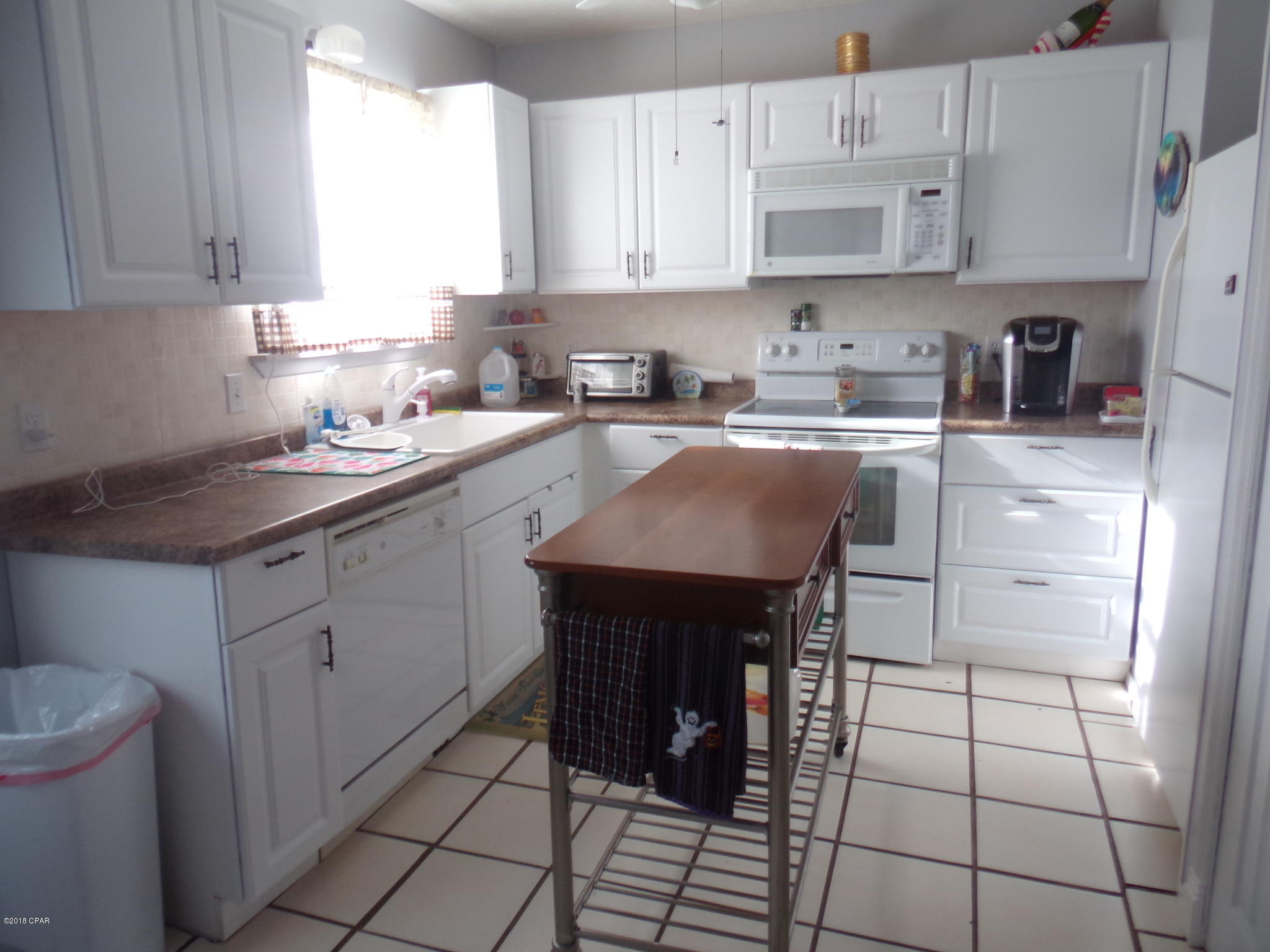 Move in ready! This quaint beach home has fresh paint, newer roof, new doors, new fence, new bath vanities, new kitchen cabinets, counters, lighting and more. There is a well for the sprinkler system. The outside is a Bird lovers paradise!! Take a step out back and you will know exactly what we mean! Located just a few blocks to the Gulf of Mexico. City water and private septic.