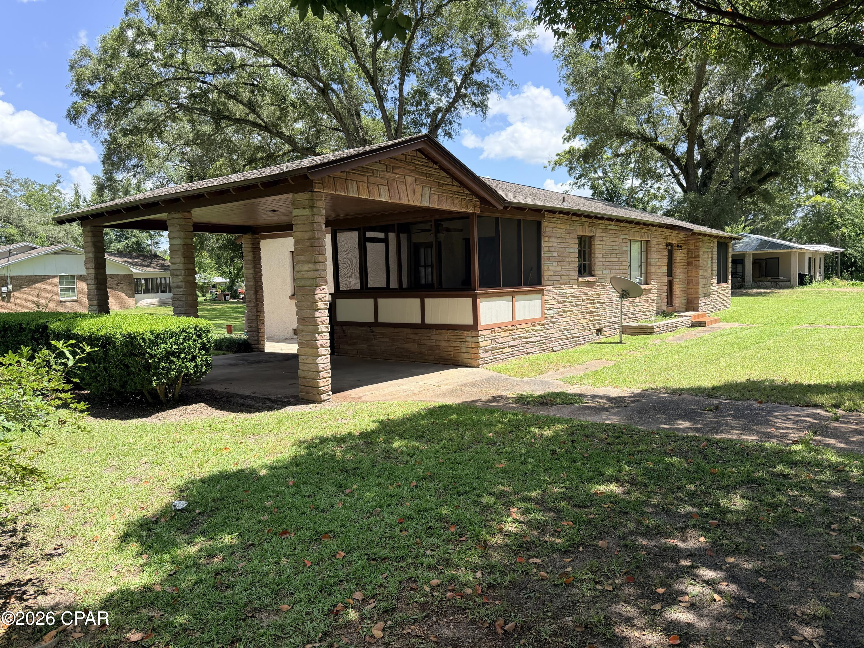 CURRENTLY UNDER CONTRACT, SELLER WILL CONSIDER BACKUP OFFERS 
Nestled in the peaceful Florida Panhandle, this charming corner-lot home offers a world of potential. Just 45 minutes from Dothan, Alabama, an hour from both Tallahassee and Panama City, and just a little over an hour from the beautiful shores of Mexico Beach, the location is truly ideal.

Inside, you'll find a cozy three-bedroom, one-bath layout just waiting for your personal touch. Back porch was recently screened with easy to repair screen boxes. The home features a gas fireplace that, with the simple addition of a gas tank, can bring warmth and ambiance to your living space.

All measurements are approximate and were done by agent along with measurements from Property Appraisers website.