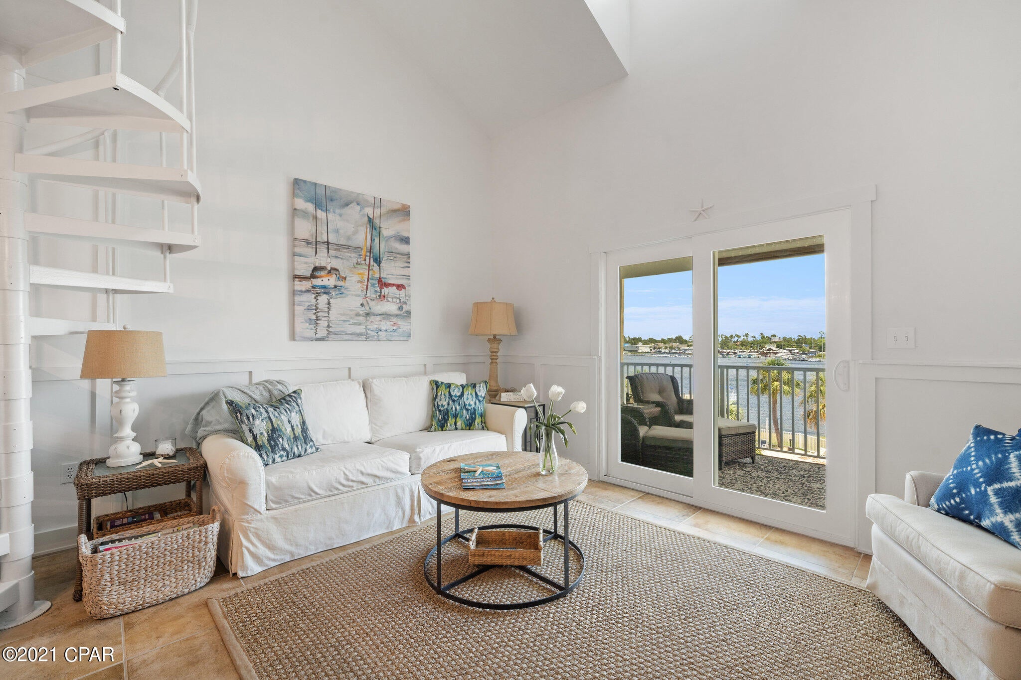 Beautiful 3rd floor condo located on Grand Lagoon. The kitchen has stainless steel appliances, beverage fridge, and coffee bar. There is beautiful Wainscotting throughout the condo and unique barn doors in the bedroom. The spiral staircase will lead you to the lovely decorated loft area with additional sleeping space and private closet. The private balcony offers beautiful views of Grand Lagoon. 

The Treasure Cove property has a swimming pool, private dock, and is centrally located to restaurants, grocery, marina, and St Andrews State Park.

Age, room size and sq footage is approx.
