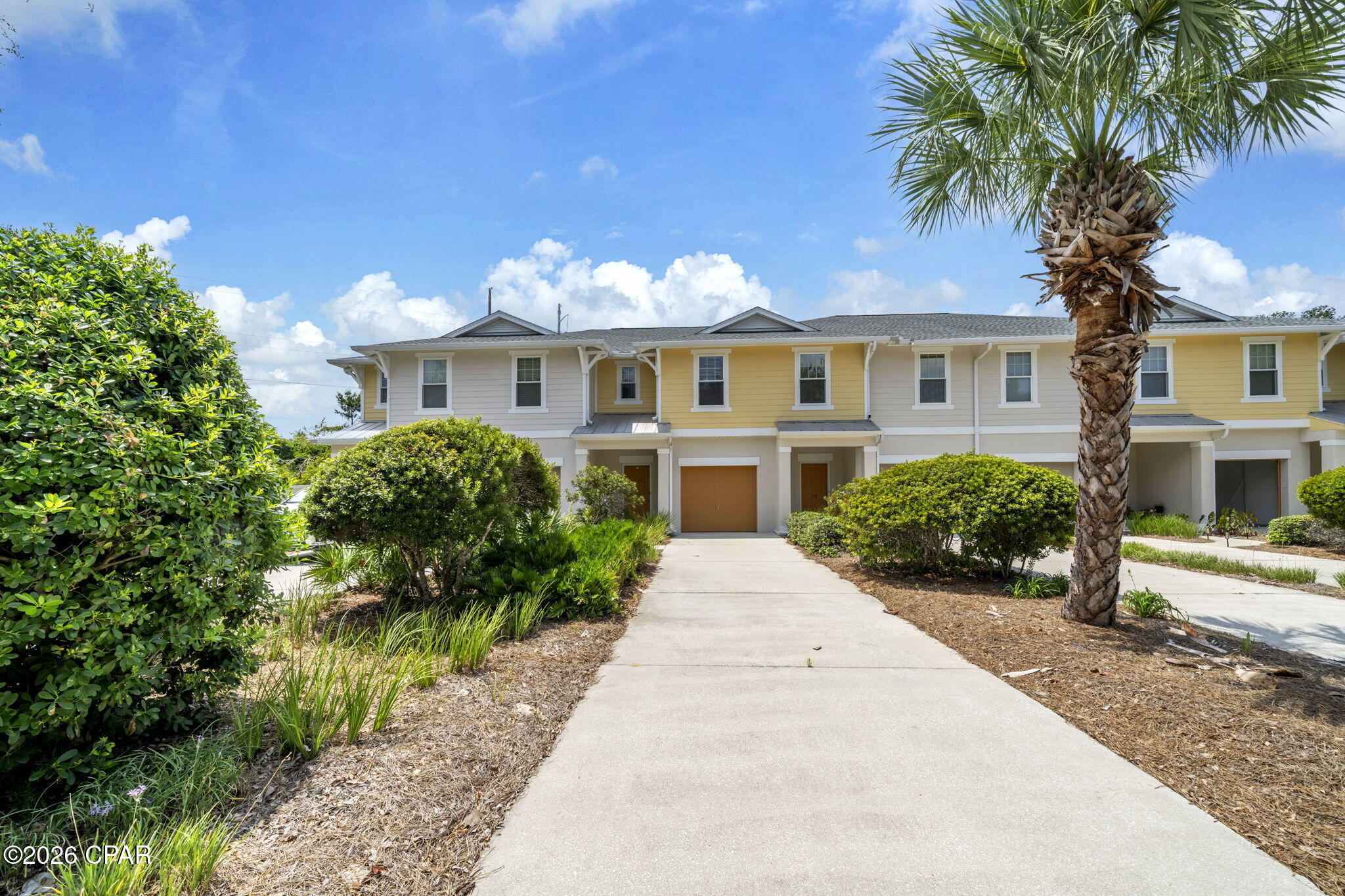 Here is your opportunity in the sought after west end community of Whisper Dunes! This well maintained home is waiting for your personal touches as a primary residence or second home in a community that does not allow short term rentals. Outstanding location close to the beach, and 5 miles to Pier Park to the east, and 5 miles to 30A to the west. The community has a beautiful pool in the back of the community that backs up to conservation land. This Beazer home has quality construction with concrete block on the first floor and hardie siding on the second floor. Exterior was painted in 2025. New roof in 2025. A/C unit was replaced in 2022. Open floor plan with tile flooring on the main level with the kitchen, living and dining area. Kitchen has stainless appliances and solid surface counters. There is a powder bath off the living area. An open patio off the living area offers private outdoor space and extends your living and entertaining space.
