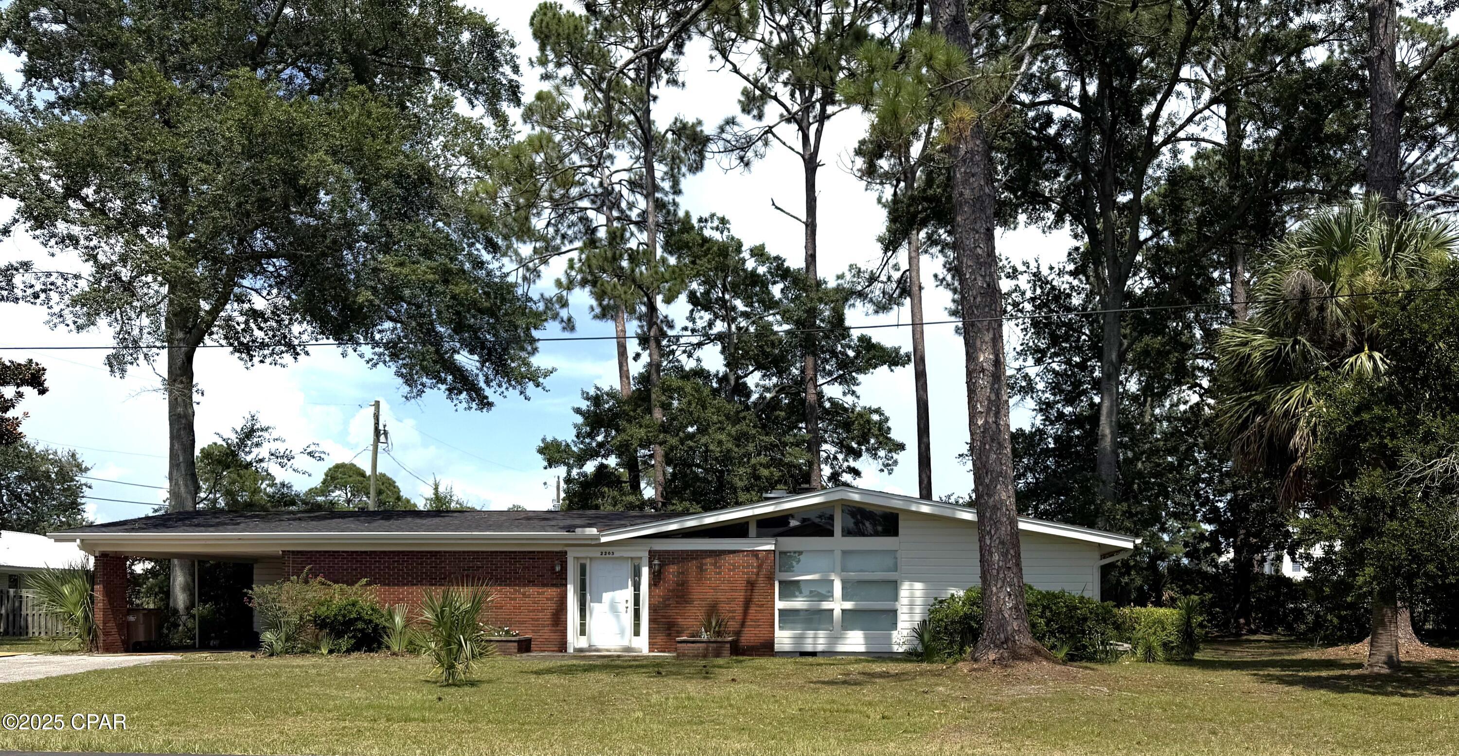 Great corner lot with views of Constitution park and peek-a-boo views of St Joseph's Bay. This 3 bedroom 2 bath home is situated in one of the longest established neighborhoods in Port St Joe and is a great jumping off point form almost any option one could want. No across the street neighbors as the long established Constitution State park offers easy access to stroll all the way to St Joseph Bay only a short walk or quicker golf cart ride to enjoy the tradition of nightly sunset watching. Easy access as well to the PSJ school grounds. If you love established trees, you will not find any better and older oaks, pines, and magnolias in town. Irrigation system and newer A/c system as well. Home will need some renovations and upgrades, but the location and grounds are setting the value.