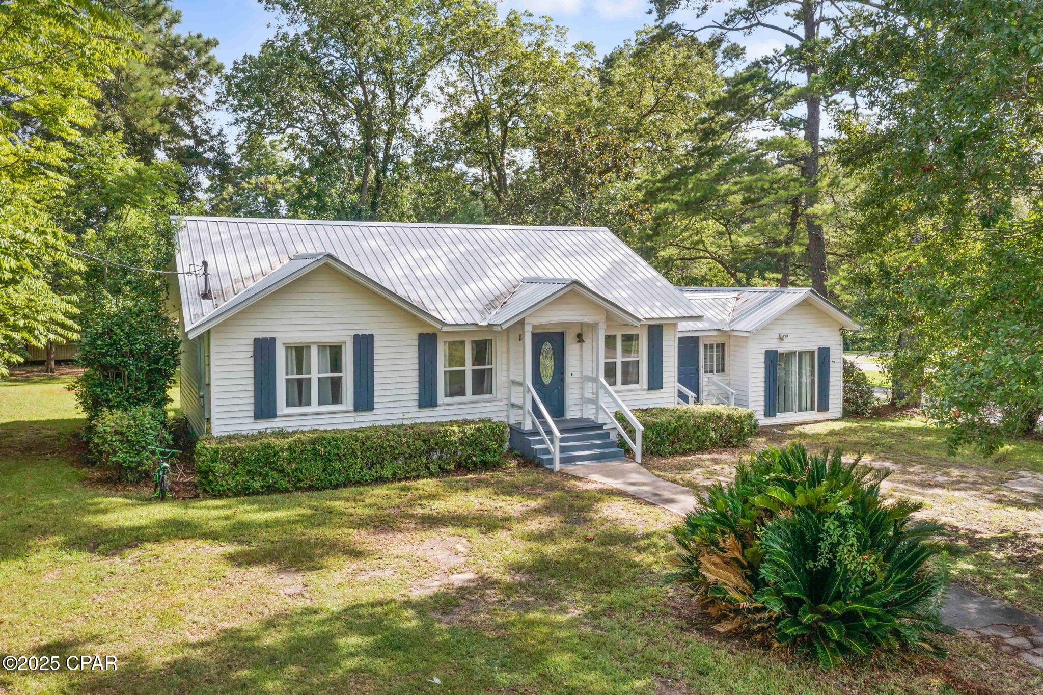 Welcome to this adorable 3-bedroom, 2-bath home situated on a spacious corner lot in the city of Bonifay. Step inside to a warm and inviting open living and dining area, complete with vinyl plank flooring and a charming decorative fireplace that adds a touch of character and history to the space. The beautifully updated farmhouse-style kitchen features an abundance of white shaker cabinetry, sleek subway tile backsplash, stainless steel appliances, and a clean, modern aesthetic that perfectly blends style and function. Outside, you'll find not one but two storage sheds, one of which includes dual lofts for additional storage or workspace potential. Enjoy the convenience of being within walking distance to local shops, restaurants, and grocery stores--everything you need is right at your fingertips!