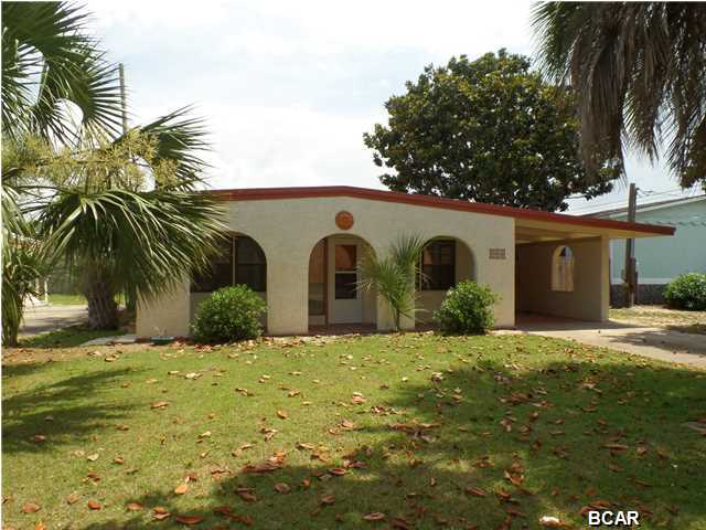 Lovely beach home with in ground pool, fenced back yard, 2 bd, 1 ba, carport and just one block from the Worlds Most Beautiful Beaches! This home is a Spanish style bungalow with a 16x12 yard building which could be used as a pool cabana. Many upgrades such as tile through out and new stainless appliances. This home would be great as a weekend getaway or could be used for vacation rental for an investor. All information is believed to be accurate and correct; buyer to confirm & verify if important. All measurements are approximate.