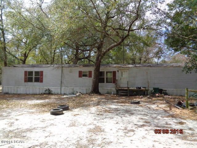 2001 SINGLEWIDE MOBILE HOME ON .88 ACRES+- SHADED CORNER LOT.BANK OWNED PROPERTY IN NEED OF SOME WORK. CLOSE TO EBRO AT HWY 20 AND HWY 79. ONLY 30 MIN TO BEACH AND TO I10. INFO FROM PROPERTY APPRAISOR, PLEASE VERIFY INFO IF IMPORTANT.  CALL FOR YOUR APPOINTMENT.