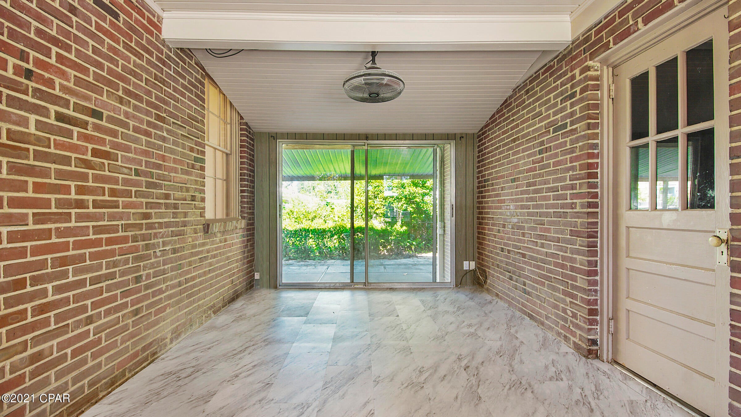 BEAUTIFUL COVE HOME ON A CORNER LOT! The interior of this brick home features 3 bedrooms, 1 full bath, hardwood floors, a formal dining room, fresh paint, ample natural light, 2 living areas, a bonus space (use for Breakfast Nook, Pantry, Sitting Area, Craft Space, etc.) and a 1 car garage. The kitchen has solid surface counter tops, white appliances, soft close drawers, and tile flooring. The exterior features a corner lot, a covered front porch, an XL covered back porch (great for entertaining), a newer roof, a fenced-in side yard, and an 32x12 workshop with carport. This home has been well loved and is in need of a new homeowner. Call today for your own private preview. All ages, sizes and measurements approximate; buyer to verify if important.