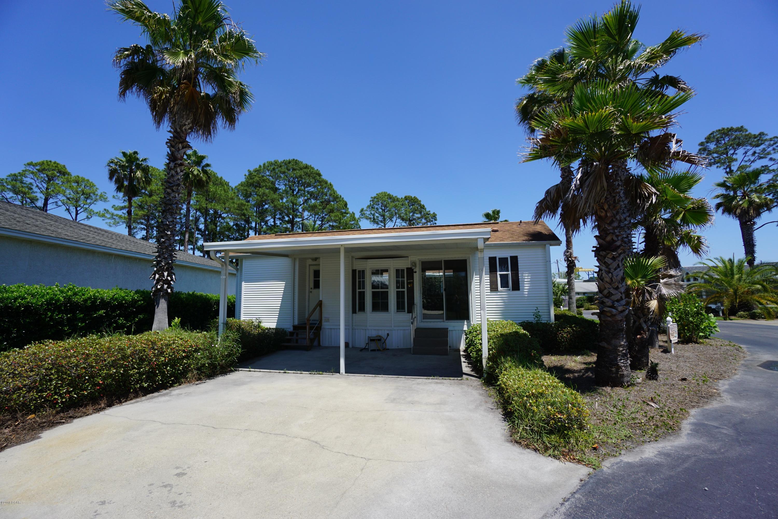 Check out this adorable Emerald Pointe Resort home! This home has new paint throughout, new flooring, brand new stainless appliances, new light fixtures and kitchen cabinets have just been painted. It looks like a new house! You will also love the covered patio. Did I mention this home is next to the community pool? Wow! Don't wait as this one won't be around long. This  resort has 2 pools, a hot tub, shuffleboard and a clubhouse with exercise room. Emerald Pointe is located across the street from the Navy Base and is close to great Restaurants, shopping and entertainment. You are also super close to the white sandy beaches of Panama City Beach!  All info is approx. and must be verified by Buyers.