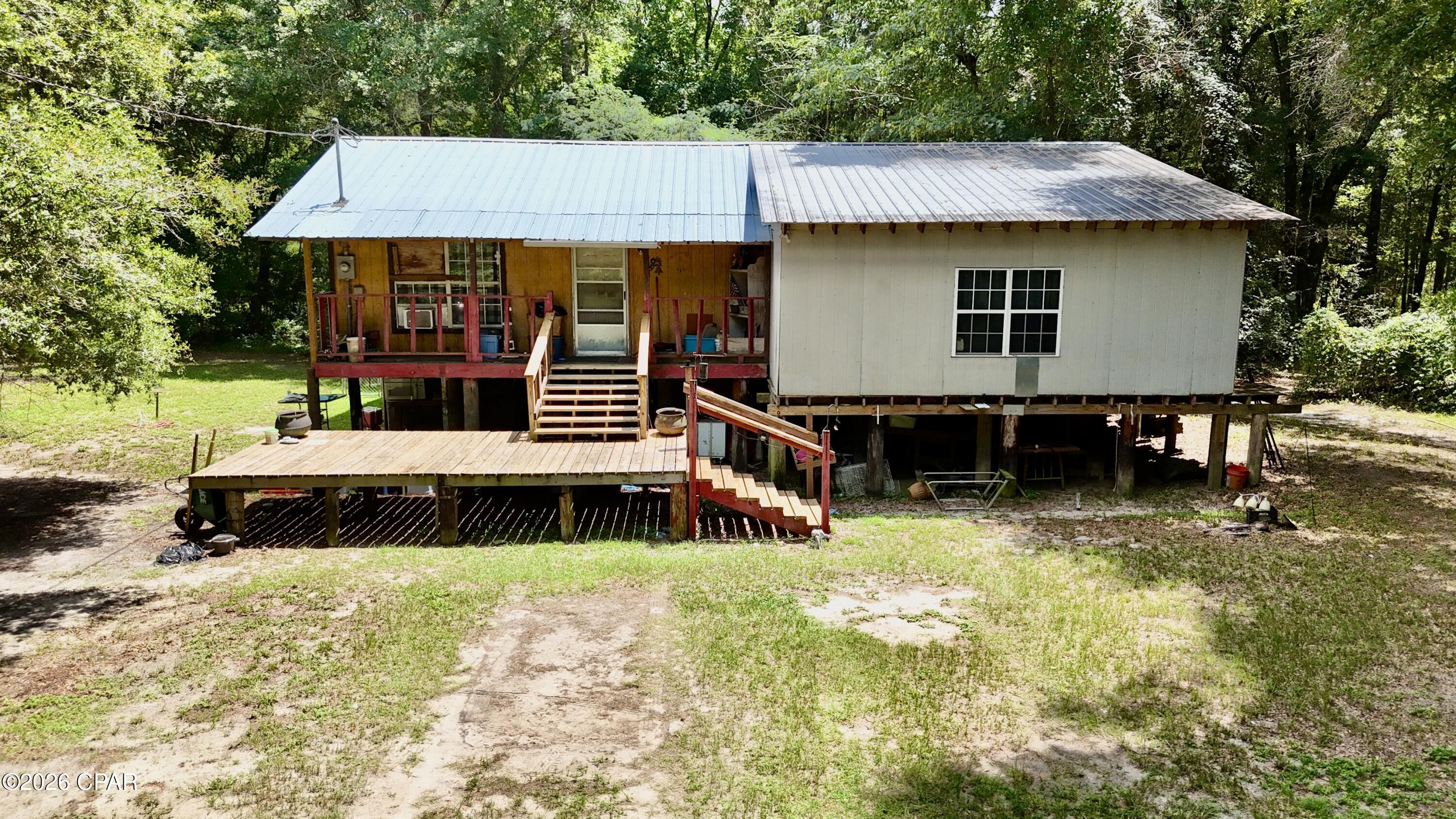 Opportunity awaits with this spacious 3-bedroom, 2-bath home offering over 2,000 square feet of potential on more than 1 acre in the heart of Ponce de Leon! Located just a short walk from Ponce de Leon Springs State Park, this property is the perfect fixer-upper for investors, renovators, or buyers looking to create their dream home. Bring your vision and your construction tools to complete this home and unlock its full potential.

Whether you're looking for a primary residence, a vacation getaway, or an income-producing property, the possibilities are endless. With over an acre of land, there's plenty of room to expand, create outdoor living spaces, or simply enjoy the privacy and peaceful surroundings. This property has the potential to make an excellent short-term rental, Airbnb, or long-term investment.

Enjoy being just minutes from Morrison Springs and Vortex Spring, while the white-sand beaches of Panama City Beach are less than an hour away. Surrounded by some of Florida's most beautiful natural attractions, this property offers the ideal combination of recreation, convenience, and investment potential.

Don't miss this opportunity to bring your vision to life. Contact your favorite agent today to schedule your private showing. Buyer and buyer's agent to verify all measurements and any other information deemed important.