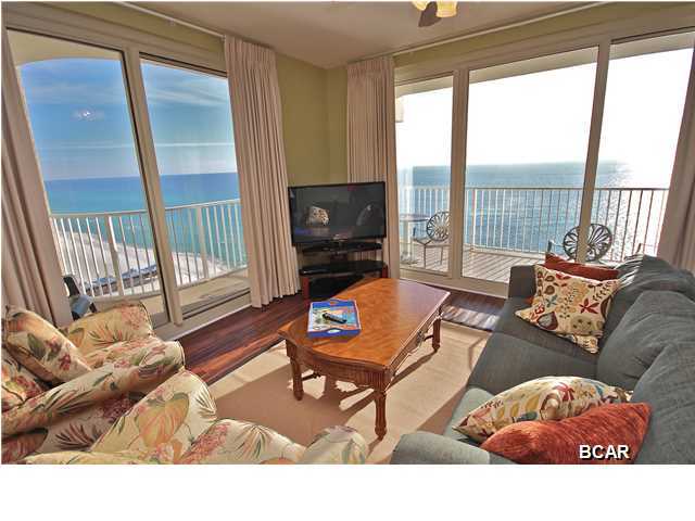 OWNER FINANCING AVAILABLE! Enjoy unobstructed panoramic views of the pool and beach from this gorgeous corner unit. This floor plan is the most sought after plan in the building. The unit features large sliding glass doors, a true Gulf front master bedroom with access to the balcony, Luxury Vinyl Tile throughout which looks like hardwood flooring, a new upgraded washer and dryer, upgraded light fixtures, flat screen TVs, and a separate bunk room with a door (just like a 3rd bedroom). This unit is nicely furnished and will not disappoint anyone. It also comes with an ASSIGNED DEEDED COVERED PARKING SPOT so you'll never have to worry about finding a parking place in the garage. You will realize Shores of Panama is a one of a kind resort in Panama City Beach from the second you pull up  to the elegant grand entrance. This resort is unlike any other with beautiful exterior details and impressive modern architecture. Shores of Panama is the ultimate vacation destination with multi-million dollar amenities: GOREGOUS 14,000 SF lagoon style pool which is the nicest on the beach, tropical pool deck with upgraded beach chairs, hot tubs and a tiki bar, 500 ft of beach frontage, fitness facility, indoor heated pool which the snowbirds love to have, onsite spa, a ball room and more. *SELLER IS WILLING TO OFFER SELLER FINANCING. Buyer to verify all info and room dimensions.