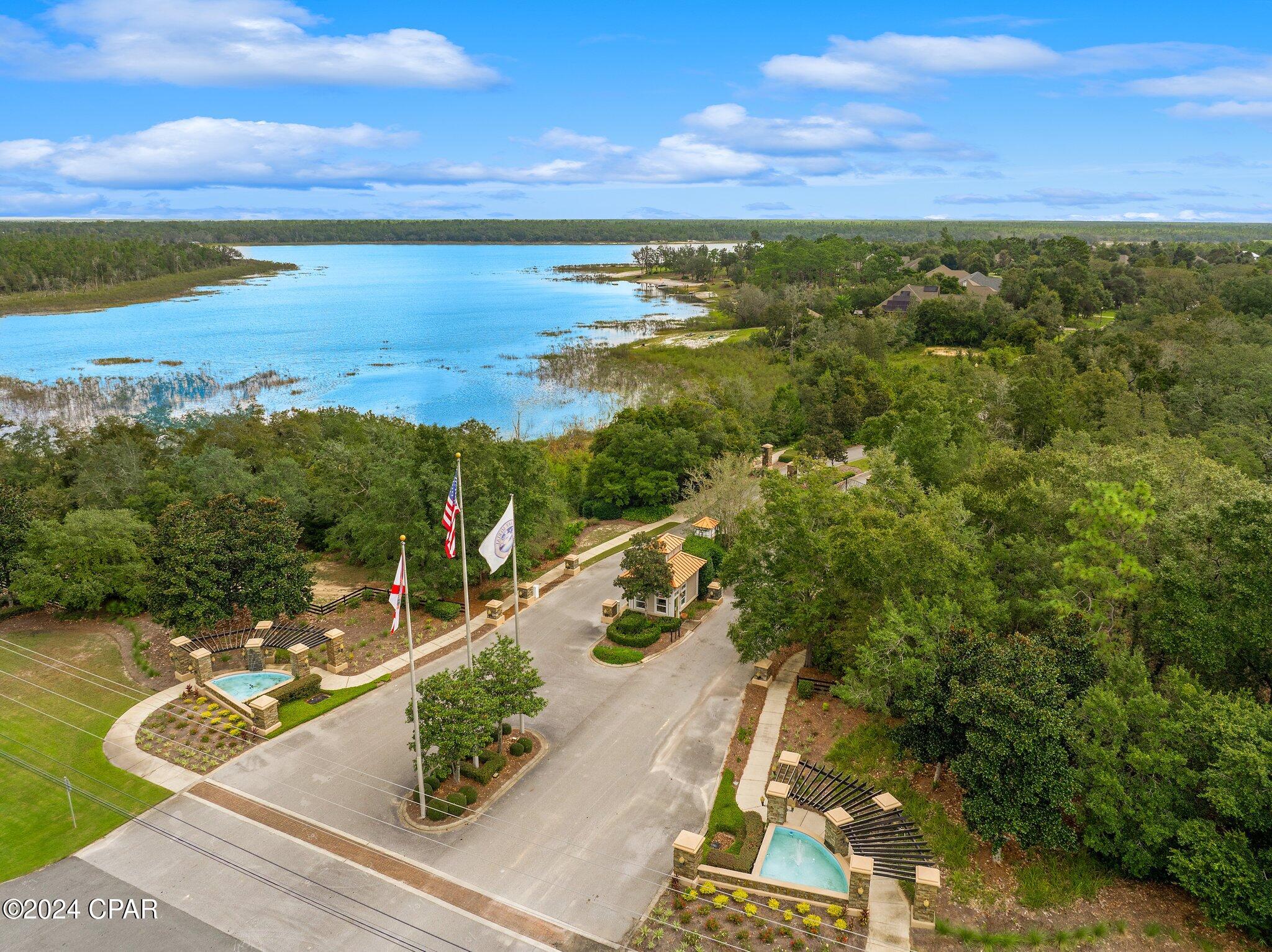 WELCOME TO 12815 LAKE MERIAL STRAND DRIVE - A BEAUTIFUL LAKEFRONT LOT LOCATED IN THE MUCH ANTICIPATED NEW PHASE OF LAKE MERIAL.  LAKE MERIAL SUBDIVISION IS ONE OF THE FEW GATED COMMUNITIES IN THE AREA. THIS 1/2 ACRE LOT IS NESTLED ON THE 300 ACRE SPRING FED LAKE. YOU WILL LOVE THIS PEACEFUL NEIGHBORHOOD. IT HAS A PERFECT BLEND OF SAFETY, COMFORT AND CONVENIENCE. THE BACKYARD WILL BE IDEAL FOR THE PERFECT SUNSET, RELAXATION, ENTERTAINING AND FISHING. TAKE A GOLF CART RIDE TO ONE OF THE POPULAR FOOD TRUCKS OR JUST ADMIRE THE TRANQUILITY OF THE NEIGHBORHOOD.  THIS LOT PRESENTS A FANTASTIC OPPORTUNITY FOR BUYERS TO SETTLE IN A WELCOMING COMMUNITY. DON'T MISS YOUR CHANCE TO OWN A LAKEFRONT EXPERIENCE WITH SERENE SURROUNDINGS AND AMENITIES.