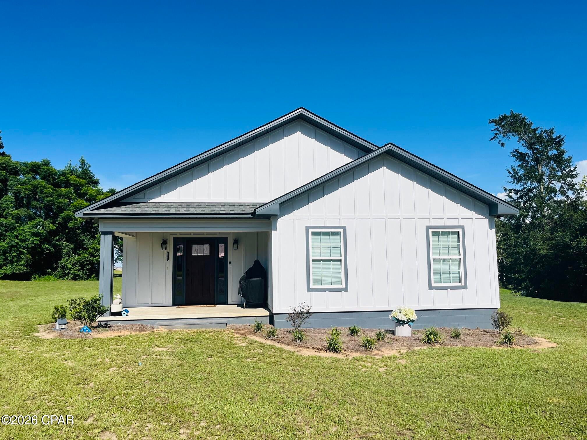 NEWER CONSTRUCTION HOME! SURVEY INCLUDED! Welcome to this thoughtfully designed Hatcher Homes property, offering the best of both worlds--beautiful, modern construction without the wait or hassle of building. Situated on a spacious 0.82-acre lot in a peaceful and sought-after subdivision in Altha, this 1,964-square-foot home offers a comfortable, functional layout with thoughtful details throughout.

Step inside to a welcoming open-concept living space highlighted by a vaulted ceiling and an abundance of natural light. Luxury Vinyl Plank flooring flows throughout the home, creating a beautiful, cohesive look while making everyday maintenance a breeze. The split-bedroom floor plan provides privacy and functionality, while generous storage throughout the home makes it easy to keep everything organized and tidy.

The kitchen is truly one of the standout features of this home. Designed to be the central hub of the house, it offers an abundance of white shaker-style cabinetry, granite countertops, stainless steel appliances, and under-cabinet lighting. There is an incredible amount of cabinet space, making it easy to keep the kitchen organized while still having plenty of room for everything you need.

The spacious primary suite is another favorite, featuring not one, but TWO large walk-in closets. Having separate closets has been an incredible convenience and eliminates the need to share one small closet. The additional bedrooms offer great space as well, including a secondary bedroom with its own large walk-in closet.

Storage continues to impress with a large laundry room that provides additional storage space, along with a spacious pantry conveniently located off the mudroom. These thoughtful spaces have made everyday living so much easier and have helped keep the home feeling neat and organized.

Beyond the home itself, the neighborhood is a wonderful place to live. The setting is peaceful and quiet, and the neighbors have been friendly and welcoming. If you're looking for a home with space, modern conveniences, exceptional storage, and a peaceful community atmosphere, this one is truly special.