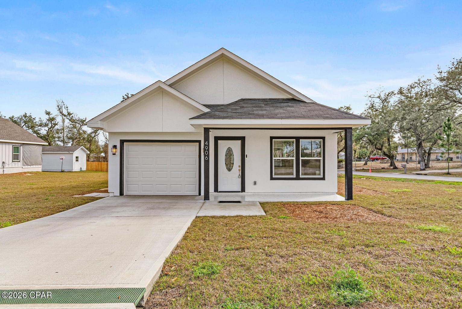 Modern Farmhouse on a Corner Lot, walking Distance to the Boat Ramp! Stunning, thoughtfully designed with high-end finishes and exceptional craftsmanship. Offering 3 spacious bedrooms and 2 beautifully appointed bathrooms, plus a third additional full  bathroom on back of the house area, this home features tile flooring throughout, creating a seamless and elegant flow from room to room. Step inside to admire the vaulted ceilings and hurricane-protected windows, providing both natural light and peace of mind. The gourmet kitchen is a dream, showcasing white granite countertops, soft-close cabinetry, stainless steel appliances, a deep sink, stylish backsplash, recessed lighting, and a spacious walk-in pantry perfect for everyday living and entertaining. The floor plan includes a spacious master suite with an elegant tray ceiling. The master bathroom offers a walk-in shower with tile-accented walls, a large walk-in closet, and beautiful French doors that open directly onto the back porch, creating a seamless indoor-outdoor retreat.
An additional bonus area with its own full bath and tile flooring provides incredible versatility--perfect as a guest suite, home office, gym, or hobby space.
Enjoy Florida living at its finest on the open back porch, complete with a fully equipped outdoor kitchen featuring deep sink, stove/grill, storage. Ideal for gatherings, grilling, and relaxing year-round.
This modern farmhouse blends style, comfort, and functionality, making it the perfect place to call home.