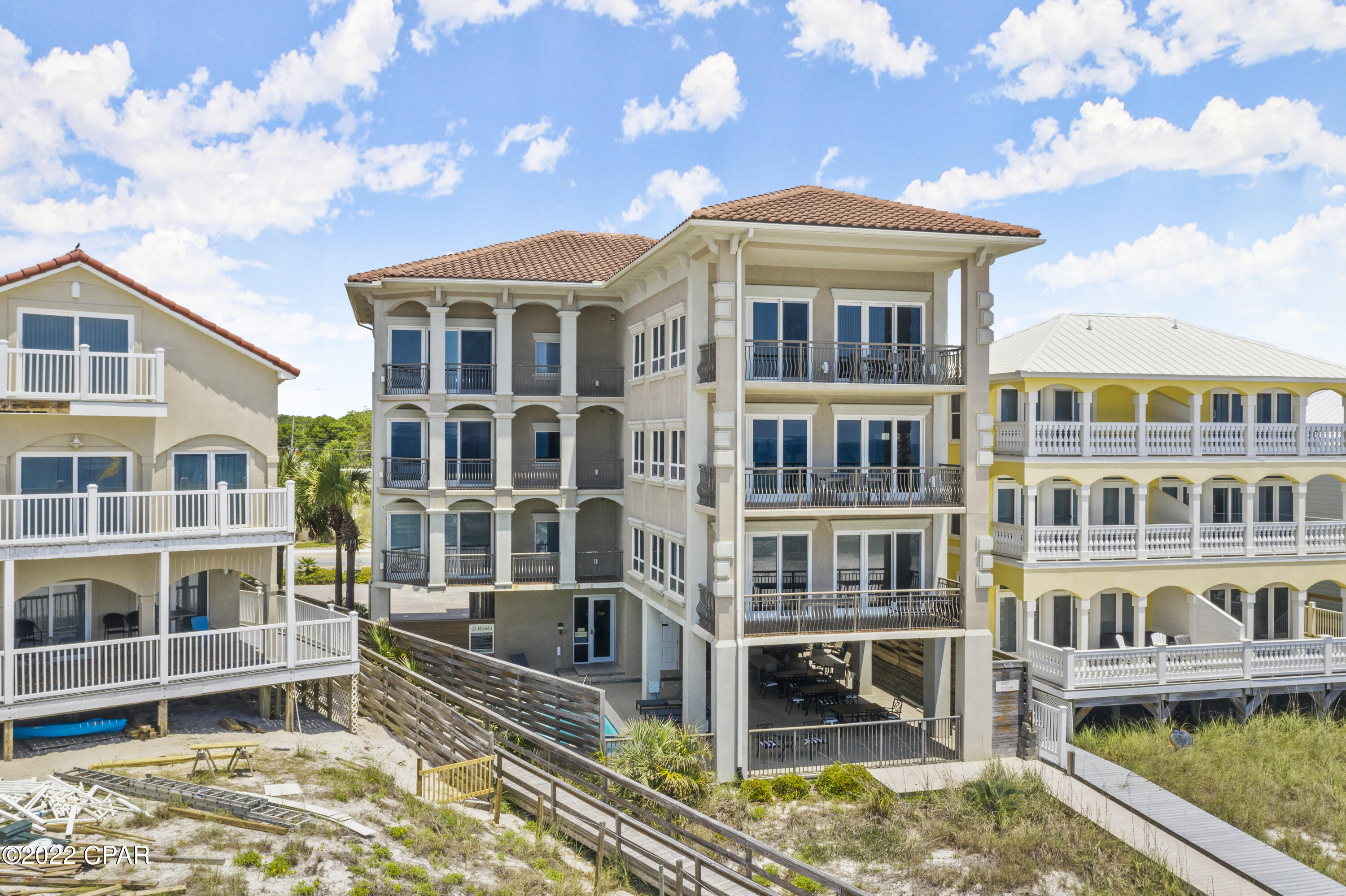 GREAT RENTAL INVESTMENT PROPERTY WITH 3-SEPARATE CONDOS in the building. Each condo has 4 bedrooms, 4.5 baths per unit with approximately 2500 SF living space and two private balconies. Gourmet kitchen with custom wood cabinets, granite counter tops, stainless appliances, breakfast bar, wet bar with sink and wine storage. Upgraded finishes throughout with gulf front balconies and gulf water views from most rooms. Whirlpool tubs at master baths overlooking the gulf. Beautiful tile floors with decorative rugs and comes lavishly furnished. Ground floor has private guest with bathroom and shower, beach access, storage and amble parking. Highest quality concrete construction with metal studs, tile roof, and stucco exterior. NO HOA FEES and GROSS RENTAL PROJECTIONS OF $435K