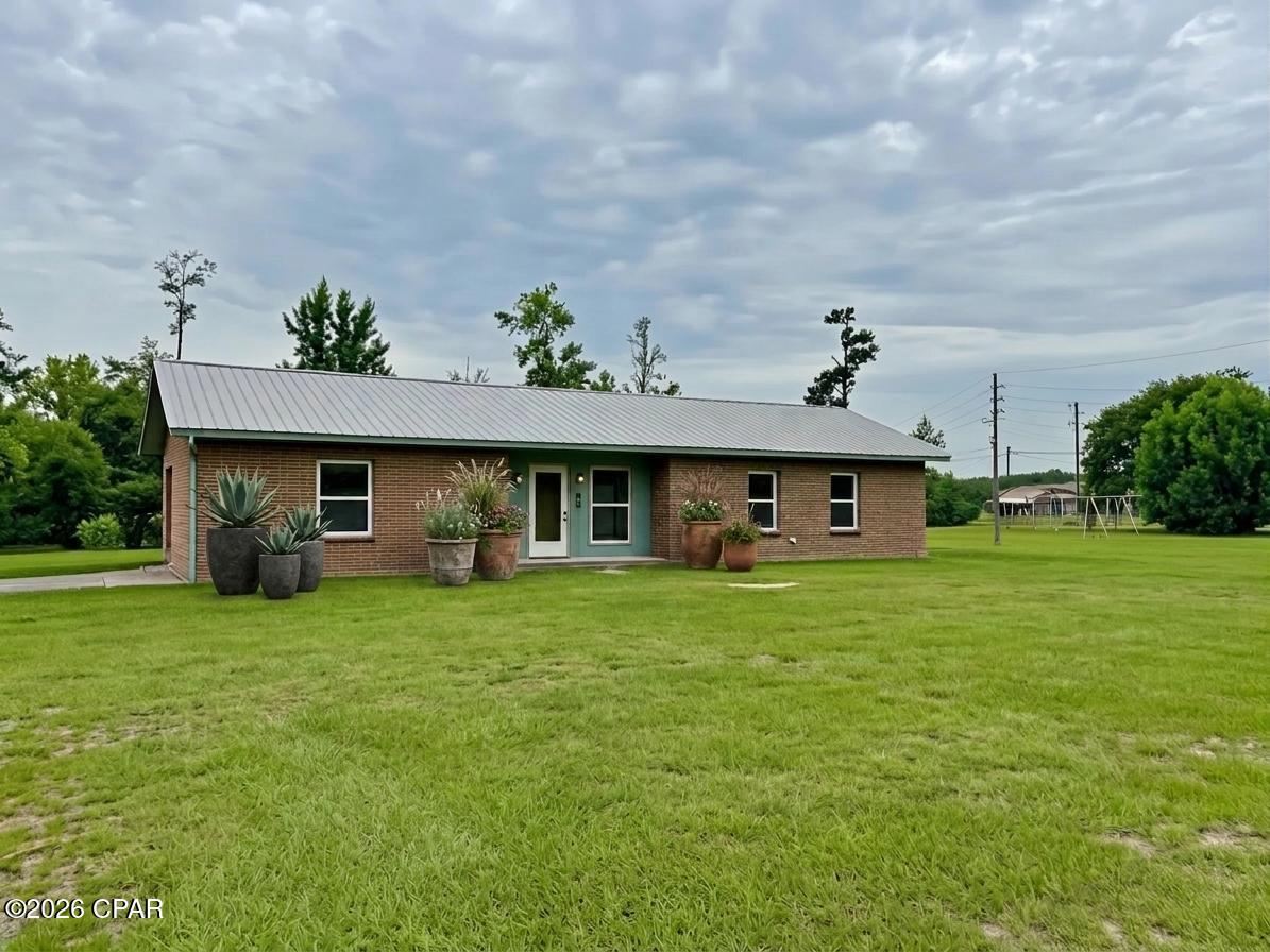 This charming 3BR/2BA completely renovated brick home on expansive corner lot is a must see! The home also features an office that could possibly be converted into a 4th bedroom. Enjoy the spacious open floor plan, featuring a large living area perfect for family gatherings or entertaining friends. The cozy fireplace adds a warm touch, making this space inviting year-round. The kitchen boasts modern appliances and convenient breakfast area. The master bedroom offers his and her closets with an en-suite bathroom. The nearly one acre corner lot provides plenty of room for outdoor activities, gardening, and entertaining. The property also includes a 16x20 portable insulated pine cabin that includes electric, window ac, refrigerator. and microwave. There is also a 12x24 shed and chicken coop included. The home is conveniently located near Merritt's Mill Pond, a 200 acre spring-fed lake renowned for its crystal-clear waters originating from Blue Springs in Marianna, FL.
There is an adjoining parcel ID#12-4N-10-0155-0000-0170 that offers .96 acres that will be available for purchase if desired.