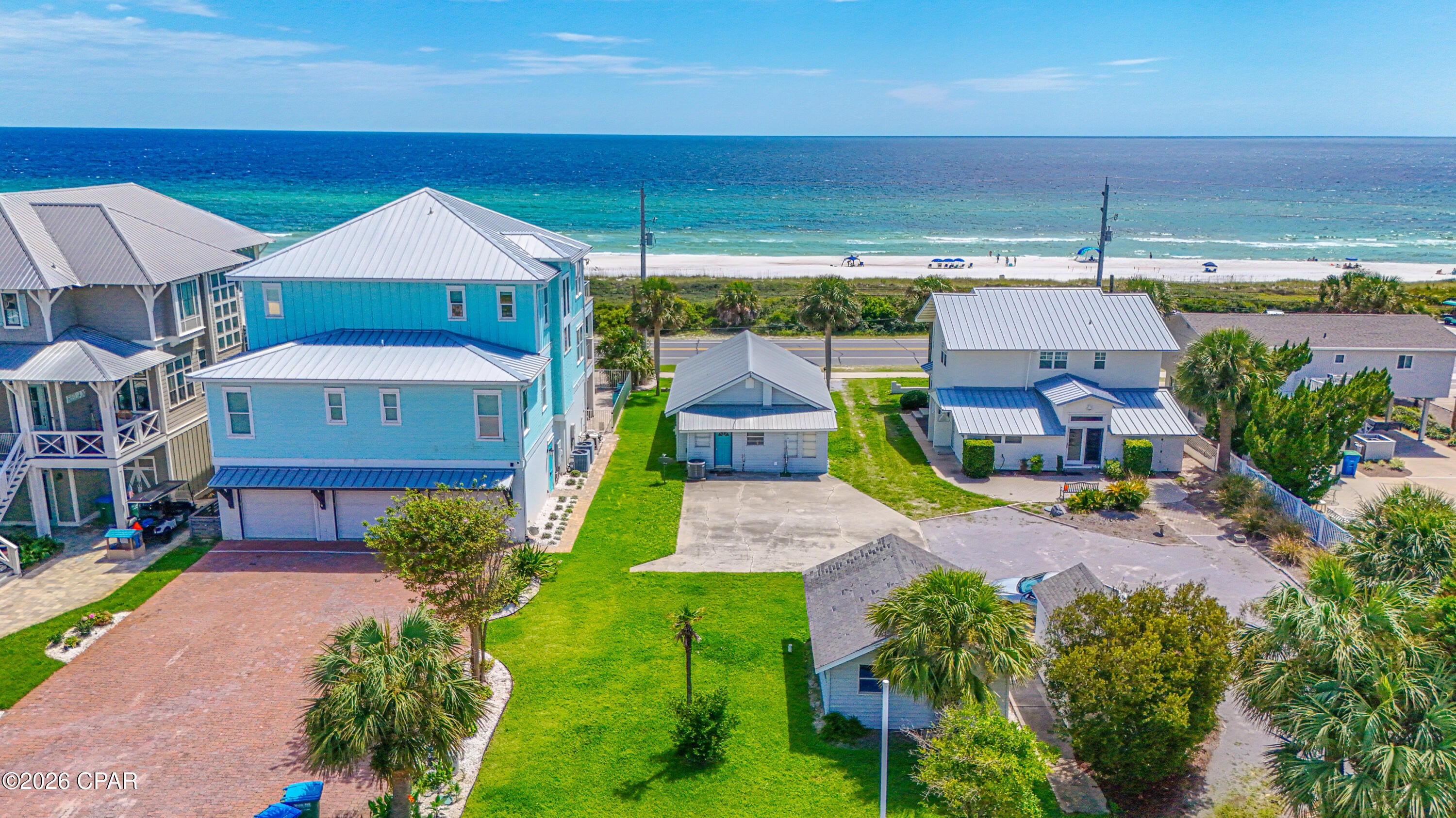 Build your dream beach home on this beautifully situated lot just across the street from the Gulf. Prime location with possible dreamy panoramic Gulf views. Enjoy a day relaxing on the beach as the pristine waves wash up over your feet and then when after enjoying a picture perfect sunset retreat to your tropical oasis. This is a rare opportunity to own a beach view lot and have your personal residence or a vacation rental machine. There is a small house on the lot. This prized piece is close to 30A and Pier Park and won't last long.