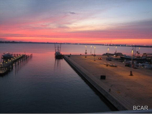 Enjoy St Andrew's sunsets, buy fresh fish from the fishing fleet, enjoy a Saturday morning at the Marina Market, walk to dinner, and watch a never ending boat parade as boats slip through the pass to harbor. Oversized balcony is perfect place to relax or entertain. Double doored entry, hard wood floors, 10' ceilings make this 3 bedroom/3 bath the perfect place to call HOME. The historic village of St Andrews is waiting for her new owner.