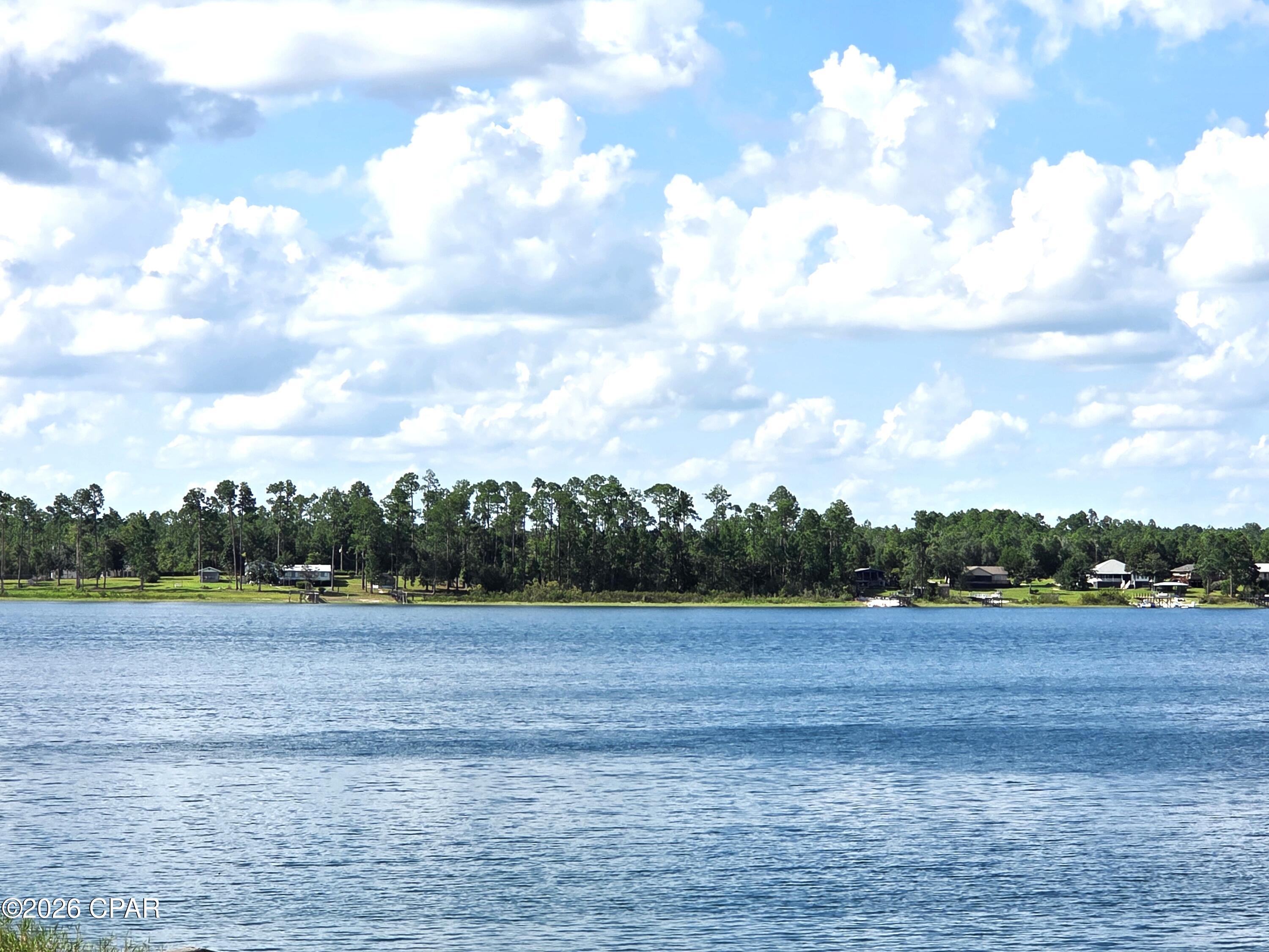 Discover this rare waterfront opportunity on desirable Silver Lake Estates community of Marianna. This lot offers direct frontage on Silver Lake--a private, spring-fed gem known for its crystal-clear aqua waters, sandy bottom, and exceptional natural beauty. As a private lake with no public access, it remains peaceful and pristine year-round. Motorized boats are not permitted, preserving the tranquil setting ideal for swimming, fishing, kayaking, canoeing, paddleboarding, and quiet enjoyment of the water.
Conveniently situated next door to the community lot, which features boat launch capabilities, this property provides easy access for launching non-motorized watercraft while maintaining the serene, motor-free atmosphere of the lake. Enjoy the privacy and exclusivity of lakefront living in a quiet NW Florida setting, just a short drive from Marianna amenities and within easy reach of Panama City beaches.
Build your dream home or weekend retreat on this special Silver Lake frontage lot and experience the rare combination of direct water access, natural beauty, and peaceful non-motorized recreation.