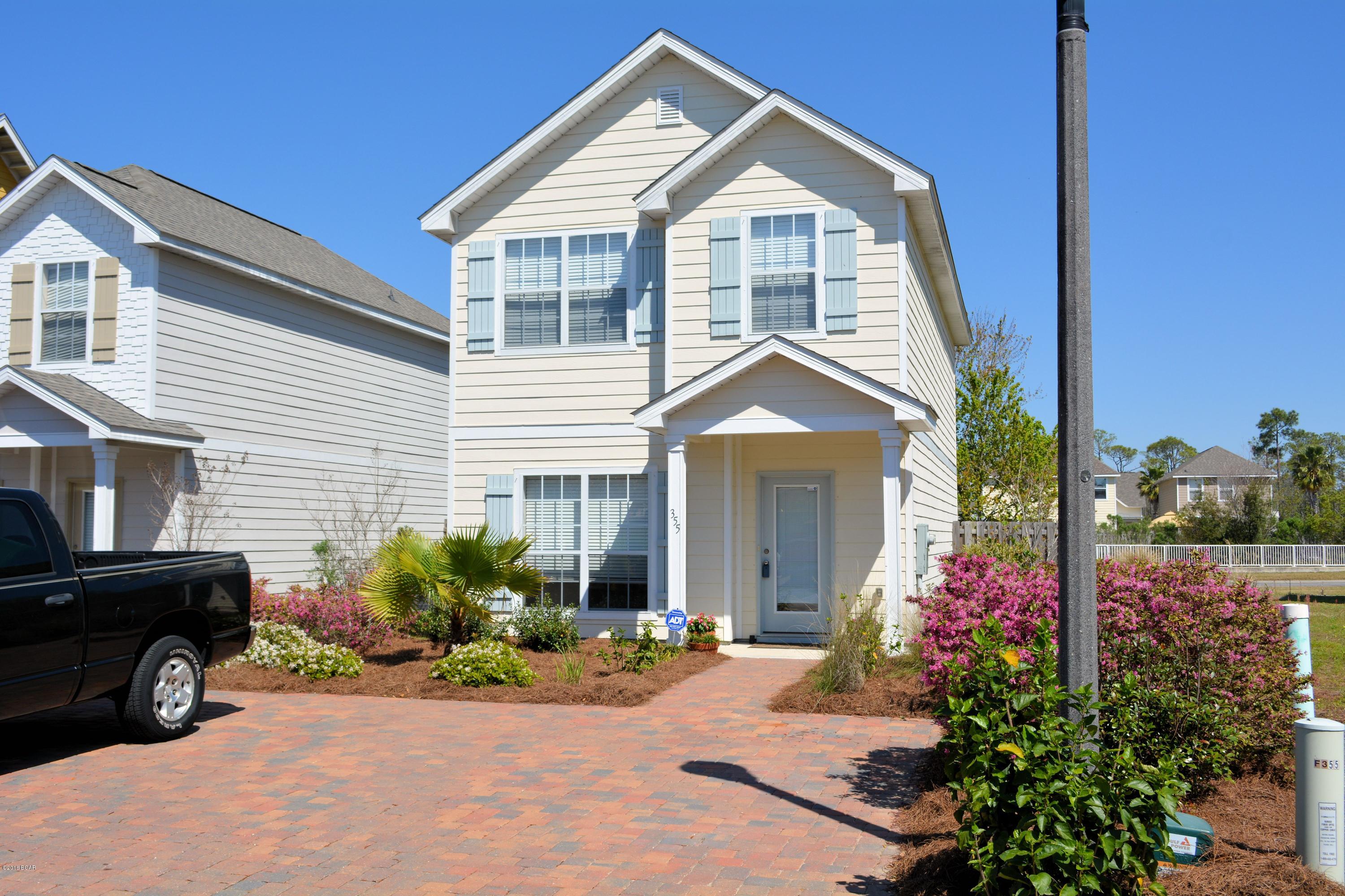 Neat as a pin and better than new best describes this Panama City Beach home.  This beautiful home features tile flooring, granite counter tops, stained cabinetry, and stainless steel appliances. You'll enjoy the entertaining kitchen and dining area that leads to a quiet and inviting patio area. The spacious master bedroom with adjoining bath offers a large walk-in closet. You'll appreciate the steps you'll save with a second level laundry room. This low maintenance home is perfect for someone that lives life on the go. Just minutes to Pier Park shopping, two blocks to the beach, and steps to association pool, you'll love everything this home has to offer. Priced to sell, make plans to see this one today because it will be gone tomorrow. All sizes are approximate, please measure to be sur