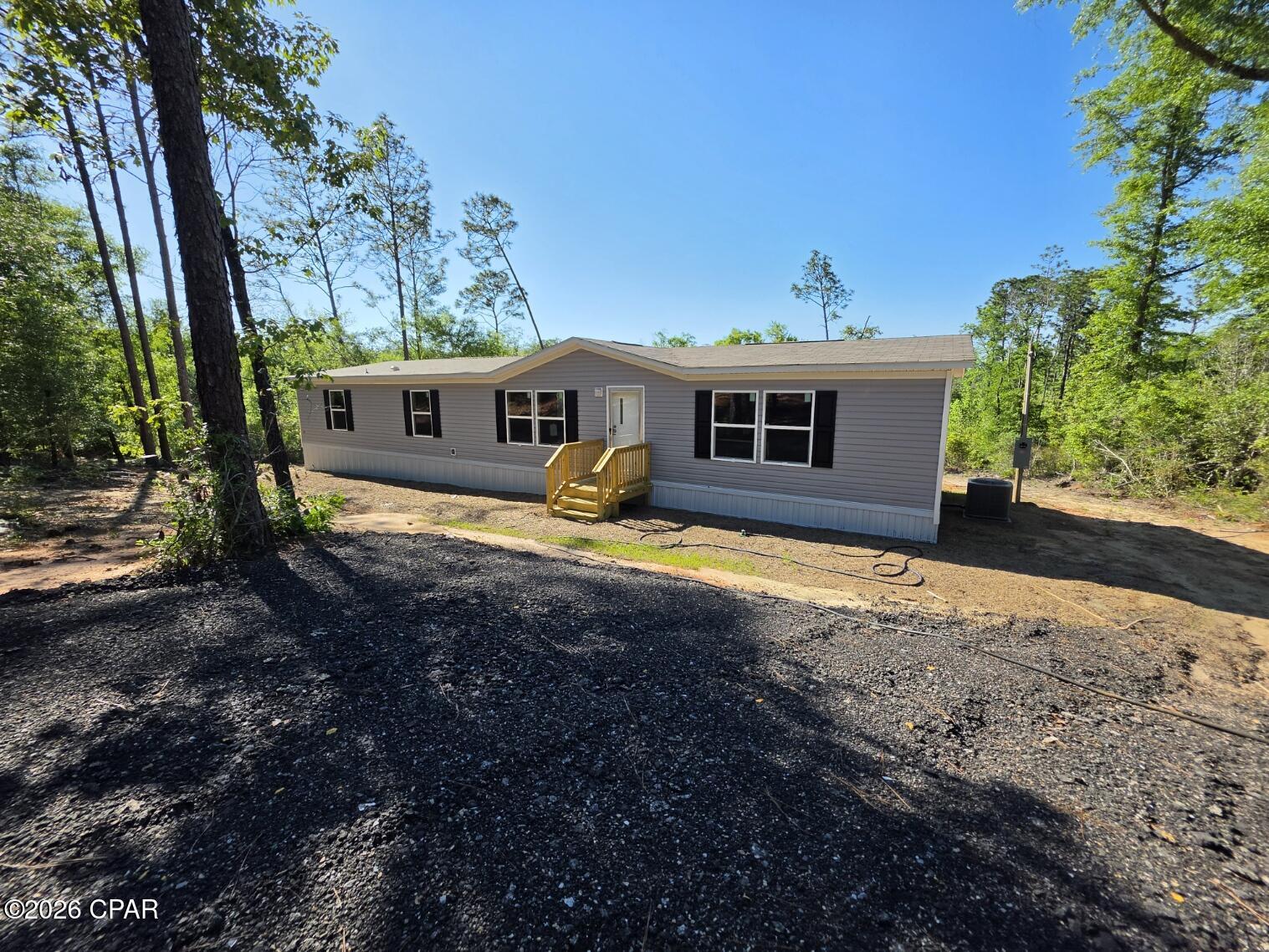 Brand-new for 2026, this manufactured double-wide sits in the tranquil Compass Lake in the Hills, Unit 5, just 30 minutes from Panama City. Spanning 1,791 square feet, the home offers a bright, open-concept layout with 4 bedrooms and 2 bathrooms. Thoughtful construction and energy-conscious features deliver comfort and efficiency, making it a fantastic primary residence or vacation retreat. Upgrades include 2x6 exterior walls for enhanced durability, upgraded insulation for year-round comfort, and energy Star appliances. 
Multiple lots and home packages available. Contact your agent for more information. All measurements are to be verified by buyer.
