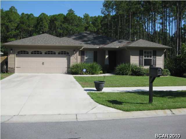 CRAFTSMAN STYLE home in one of Lynn Haven's newest subdivisions, THE PINES. This wonderful home offers a stacked stone entryway, 4 bedrooms 2 baths, very spacious and open floor plan, wood cabinets, stainless appliances, granite countertops, tile, walk in closets, separate laundry room and much mores. You will just love spending time outside in the back yard with the new privacy fence and extensive landscaping which has recently been completed, and to maintain the yard there is a sprinkler system. Underground utilities and sidewalks. sizes, ages, including sq. ft. are approx. measure if important. Click on the photo for additional pictures of this great home. Seller is offering a $1,500.00 carpet allowance with an acceptable offer.