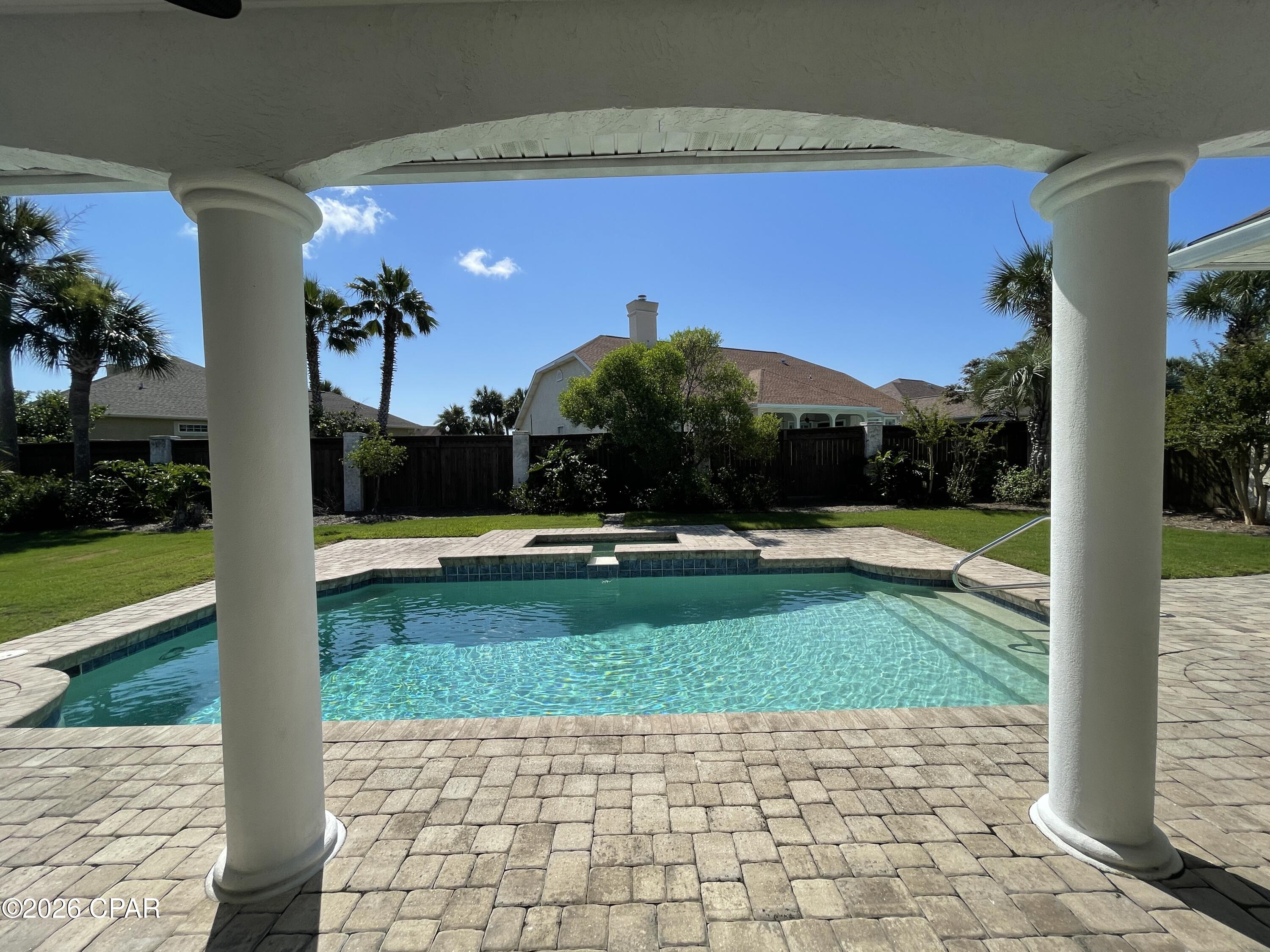 For Lease - Lawn care and pool service included! This gorgeous 3-bedroom, 2.5-bath home in the highly desirable Palm Bay community offers refined living, beautiful landscaping, and a sparkling in-ground pool and hot tub perfect for enjoying Florida's outdoor lifestyle.

A grand foyer welcomes you into the formal living and dining rooms, highlighted by Brazilian cherry hardwood flooring and soaring 10' ceilings. The formal living room features a gas fireplace and custom built-ins with a whole home surround sound system. The formal living room opens seamlessly to the spacious kitchen, equipped with custom cabinetry, granite countertops, high-end stainless appliances with a gas KitchenAid range, and an inviting breakfast nook. The home was just updated with a fresh coat of paint throughout.

The split bedroom plan provides excellent privacy. The oversized master suite accommodates a king bedroom set and offers direct access to the pool deck. The master bedroom includes updated luxury vinyl plank flooring, new blinds and fresh paint. The recently remodeled master bath includes a freestanding soaking tub, walk-in shower, double vanities, and a generous walk-in closet. Two additional bedrooms share a convenient Jack-and-Jill bathroom, and a powder room is available for guests.

Laundry room includes washer and dryer. Two-car garage.

Palm Bay offers a central location near the Navy Base, grocery stores, entertainment, and popular local restaurants.

Pets are negotiable with $250 pet deposit, $50 pet fee, and $25/month pet rent per pet.