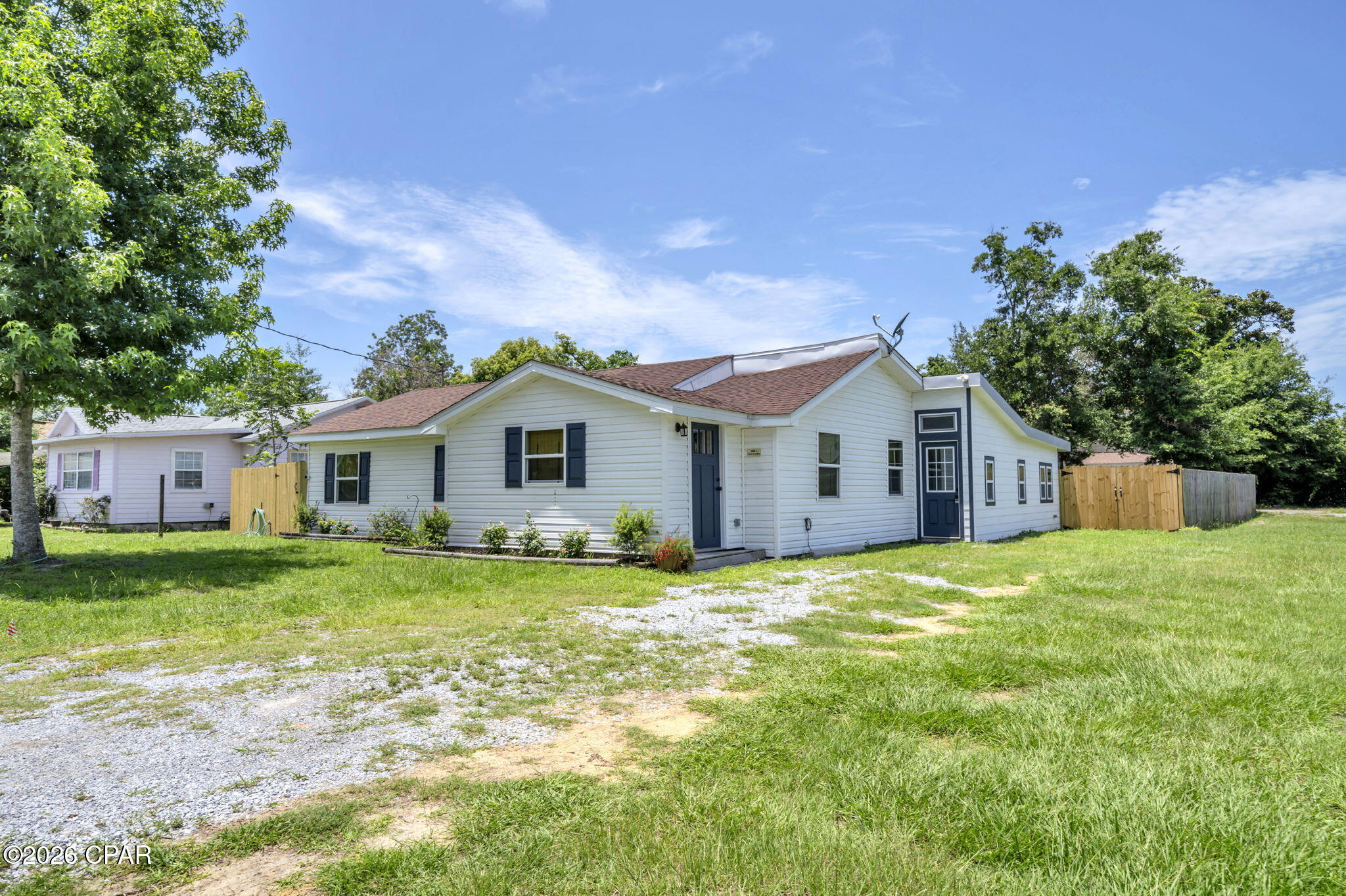 Completely remodeled and expanded to approximately 1,744 square feet, this stunning 3-bedroom, 1.5-bath home offers the perfect blend of modern comfort and an unbeatable location. Nestled just steps from the shops, restaurants, and local charm of Historic St. Andrews, this move-in-ready property is a rare find.

Inside, you'll discover a spacious open-concept floor plan featuring soaring 12-foot vaulted ceilings that create a bright and airy feel throughout the home. The beautifully updated interior includes luxury vinyl plank flooring and a stylish kitchen equipped with brand-new, never-used appliances.

The renovated bathroom offers a spa-like experience with a large walk-in shower featuring dual shower heads, elegant granite countertops, and gorgeous tile finishes.

The Owner added on to and enclosed the rear patio into a great Family Room!

Situated on a large lot, this property provides plenty of outdoor space while remaining conveniently close to Lucille Moore Elementary School and just a 15-minute drive from the sugar-white sands and emerald waters of Panama City Beach.

With extensive updates, generous living space, and a highly desirable location, this home truly has it all.
If Dimensions and Details are Important to you, please verify.
