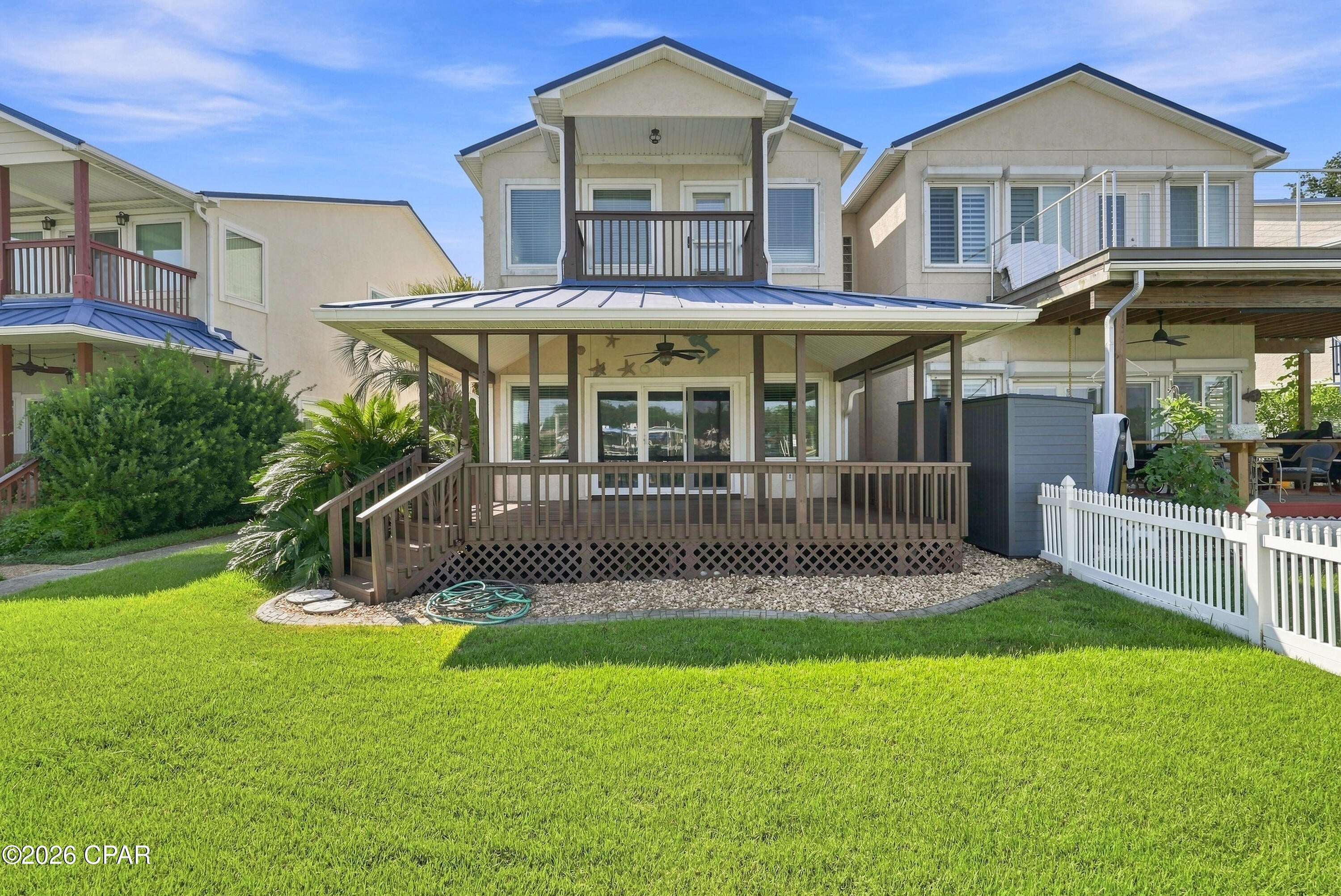 DEEP-WATER ACCESS, BOAT LIFT & 16-FOOT-WIDE BOAT SLIP! Welcome to Paradise on Pitts Bayou, where you can spend your weekends on the boat instead of in the yard! With water deep enough for boats with up to a 6-foot draft, a 16-foot-wide boat slip with a boat lift, and a full-service marina just a quarter mile away, getting out on the water couldn't be easier.

Inside, you'll find impressive 10-foot ceilings, recessed lighting, and a spacious, thoughtfully designed layout. The kitchen features wood cabinetry, granite countertops, and a large breakfast bar with seating for six. Just off the kitchen, a full-sized washer and dryer are tucked behind double doors with plenty of shelving for storage.

The double garage is more than just parking, offering an outdoor shower, laundry sink, shelving, and generous counter space for tools, projects, and hobbies. A convenient half bath and sizable storage closet are also located nearby.

The living area is truly the heart of the home, featuring upgraded lighting, soaring ceilings, and large glass sliding doors that open to an expansive covered porch. Take in the beautiful views of Pitts Bayou while enjoying your morning coffee, entertaining friends, or watching the sunset at the end of the day.

Upstairs, the waterfront primary bedroom offers a private covered balcony and vaulted ceiling, along with a walk-in closet, soaking tub, and separate shower. Two additional spacious bedrooms and a full bathroom are located on the opposite side of the home, providing comfortable space for family or guests.

With its combination of boating convenience, beautiful views, spacious living areas, and thoughtful extras, this home is ready to make waterfront living part of your everyday life. Come see why Paradise on Pitts Bayou could be your next home!