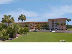 FHA approved until November 1st. Beautiful screened in Balcony, over looking the Driving Range and Par 3. The complex backs up to a 18 and 9 hole exceptional golf course. Impeccably kept grounds, In ground Pool, Club House, Inside the unit you will find Kitchen with plenty of cabinets, breakfast bar, living room/dining room combo, dining room, Master bedroom, Unit has lots of closets for all you storage needs, there is also a storage room located on the balcony. There are a lot of windows in this unit that bring in the great sunlight. Carpet in main living area and bedroom, tile in kitchen and bathroom. Ceiling fans in Living room and Master bed room. This is a great unit for the price. A must see!