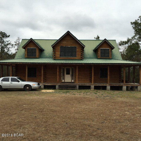 Nice log home with 3 bedrooms and 2.5 bathrooms. The house needs some finish carpentry work on the interior and most of the needed trim materials are in the house. The back of the house overlooks the pretty pond. There is a large pole barn.
