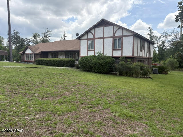 Three Bedroom/Three Bath brick/stucco tri-level Tudor on 5 acres is located in a quiet neighborhood on a dead-end street east of Marianna. Minute drive to Spring Creek Park for swimming, canoeing, kayaking, fishing. Eventually this crystal-clear creek runs into the Chipola River which can be easily navigated by boat or take a slow tubing trip to the next boat ramp.  Marianna is also home to the Chipola College, Florida Caverns State Park and for diving at the Blue Springs Park located at Merritts Mill Pond.  Within minutes you can be shopping or eating out at the many restaurants around town and by the interstate.  This home is currently undergoing renovations.  New windows and doors are on the list.  Recent appliances have been replaced, both HVAC units, both water heaters, dishwasher, plumbing repairs & new faucets. New roof in 2019. The vented basement could be a nice office, storage room, or even the 4th bedroom you need.  This is a large home that would be perfect for your large family.  Plenty of room to spread out