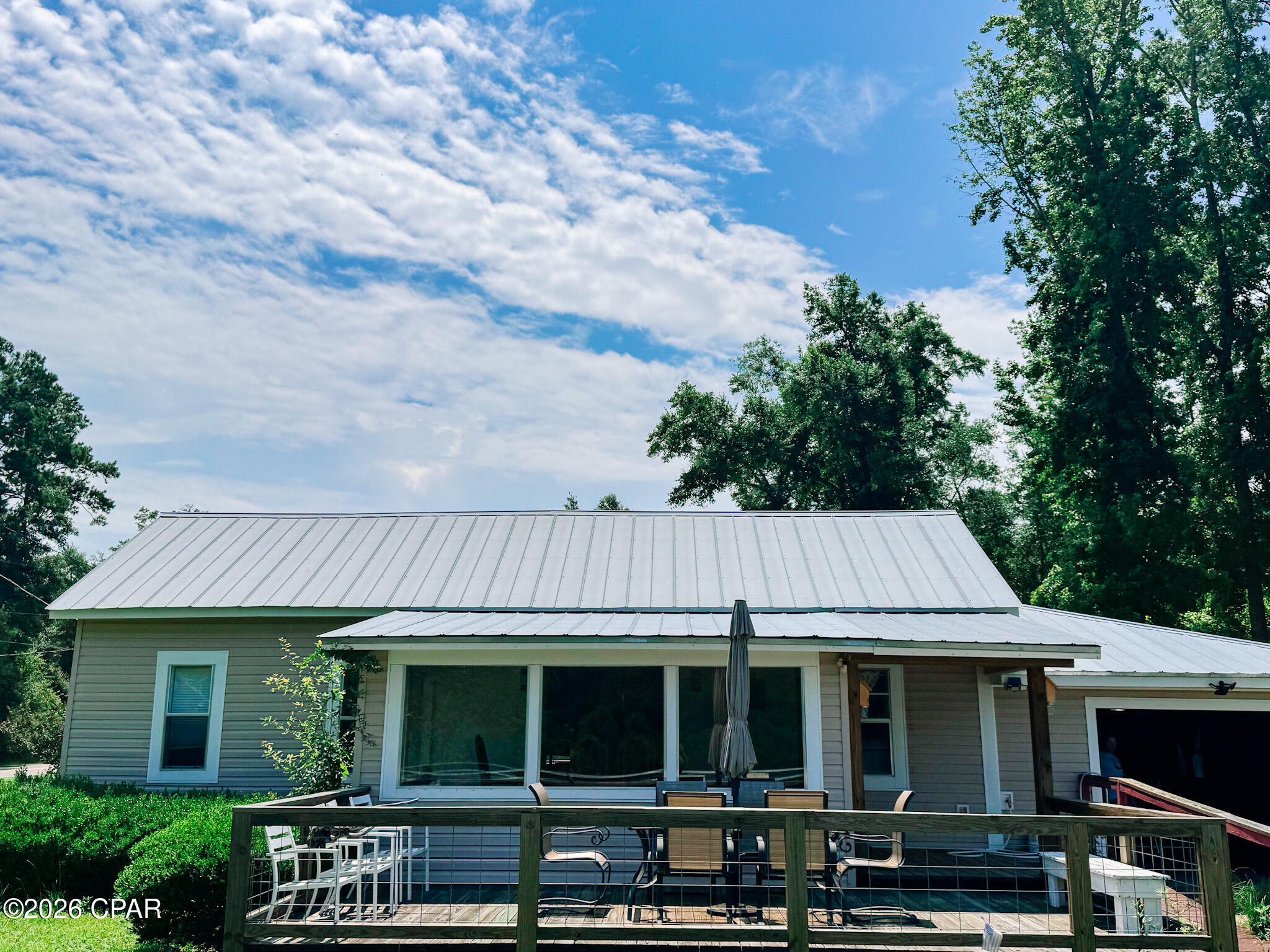 Discover an extraordinary opportunity to own a river view retreat on the breathtaking Apalachicola River, proudly located in Liberty County. This property offers seamless access to the Apalachicola River for your aquatic pleasures and the Apalachicola Forest for all the hunting and outdoor enjoyment. Encompassing .23 acres along the serene riverbank gives you views up and down the river. Garage gives you space for storage or even an option to close in. Detached for the home is another garage to do the same. You can launch your boat from the public boat ramp just .4 miles downriver. This cozy river house has been fully renovated with warmth and charm! Give us a call today!