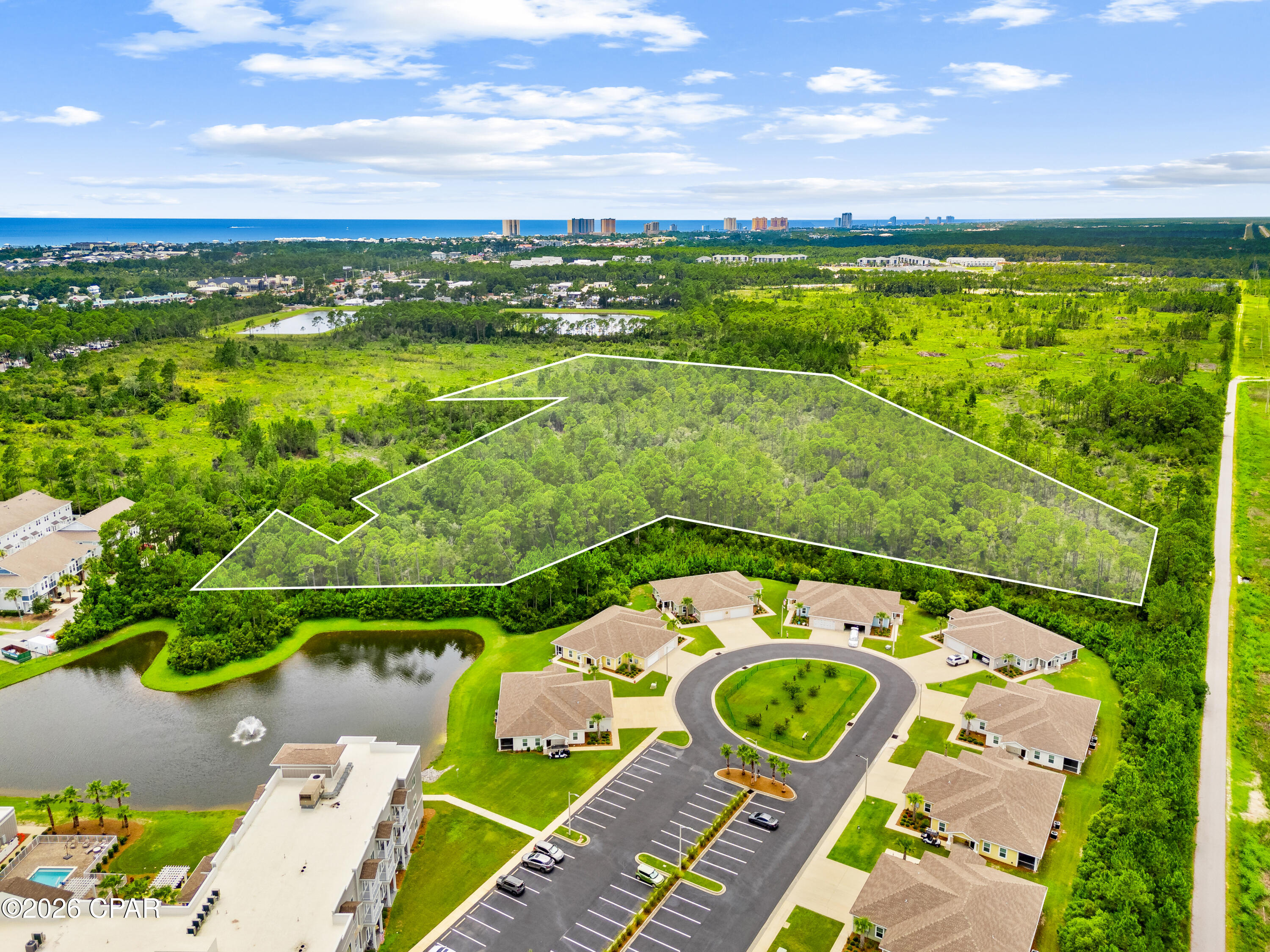 Development opportunity in the heart of Panama City Beach! This approximately 10+ acre parcel offers investment potential with dual zoning--approximately half located within Bay County and zoned AG-2, and approximately half within the City of Panama City Beach and zoned RTH (Residential Townhouse). The RTH zoning presents an opportunity for residential development, and the adjoining AG-2 portion may have the potential to be annexed into the City of Panama City Beach, subject to city approval and applicable requirements.
Conveniently located just minutes from Panama City Beach Parkway, shopping, dining, schools, and the Gulf beaches, this property is ideally positioned in one of the area's fastest-growing corridors. Whether you're a builder, developer, or long-term investor, this is a rare opportunity to acquire a sizeable tract with significant residential development potential in a highly desirable location.  The property is adjacent to approximately 1.5 miles of the paved Gayle's Trails recreational path along its northern boundary.
Buyer to verify zoning, annexation potential, permitted uses, dimensions, utilities, access, development feasibility, and all other pertinent information through their own due diligence.