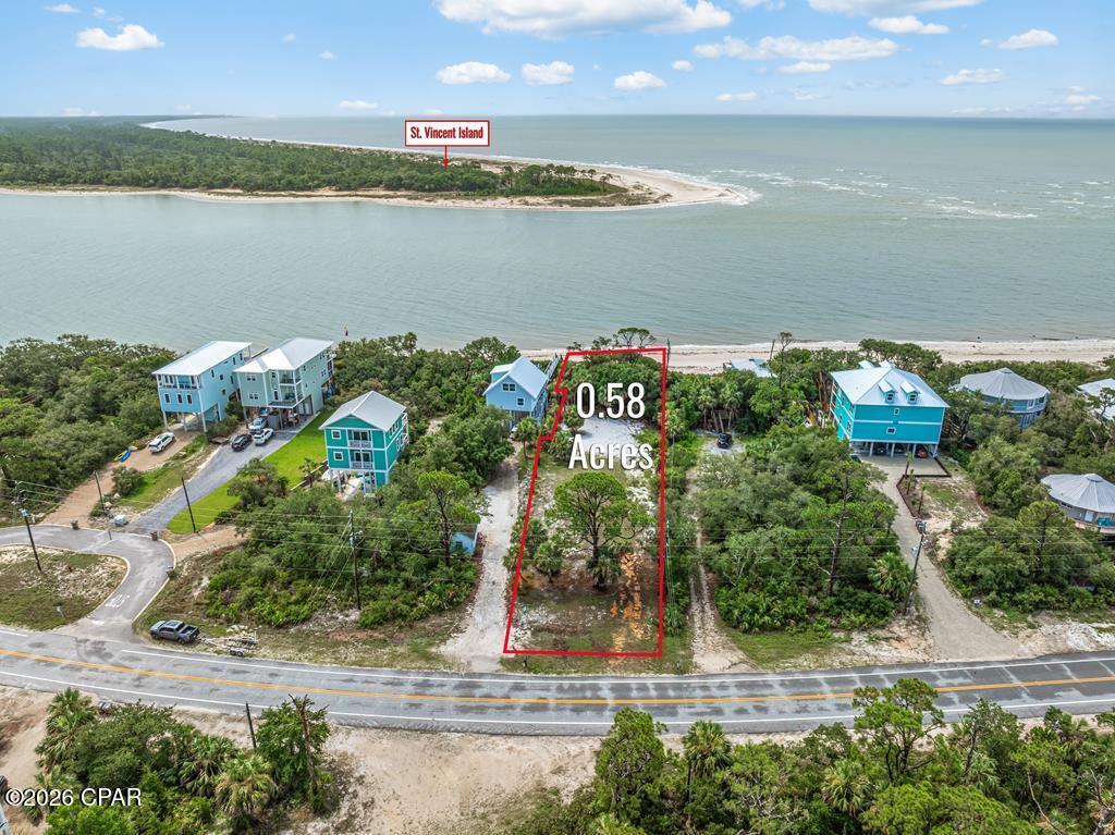 60-FOOT GULF-FRONT CLEARED LOT IN INDIAN PASS WITH DIRECT BEACH ACCESS. This 0.58-acre homesite is perfectly positioned along the beautiful, uncrowded beaches of the Forgotten Coast and is ready for your dream beach home, with house plans already in place to save time and streamline the building process. Enjoy the serenity and old-Florida charm Indian Pass is known for, where peaceful surroundings, world-class fishing, and laid-back coastal living set the tone. Located just moments from the Indian Pass boat ramp and the iconic Indian Pass Raw Bar, this property offers the ideal balance of privacy and convenience. Positioned perfectly between PSJ and Apalach for shopping and dining experiences! Whether you envision a primary residence, vacation retreat, or income-producing rental, this Gulf-front lot presents an exceptional opportunity to create your own slice of coastal paradise with endless potential.