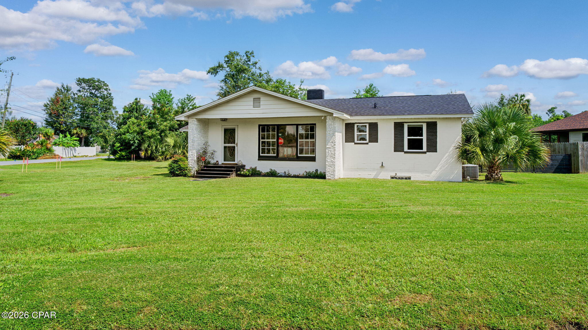 Currently Under Contract, Seller Accepting Backup Offers
Charming Ranch on an Oversized Corner Lot in the Heart of Lynn Haven

Welcome home to 501 Minnesota Ave, a beautiful ranch on a huge corner lot in one of Lynn Haven's most beloved neighborhoods. Mature palms and a manicured lawns set the tone from the curb, and the location can't be beat just minutes from Sharon Sheffield Park, Leslie Porter Wayside Park, A.L. Kinsaul Park (home to the best fireworks show around), and Panama City Country Club.

Inside, original hardwood floors run throughout, paired with warm knotty pine walls and ceilings that give the living area a cozy, coastal cabin feel. Gather around the stacked-stone wood-burning fireplace, or spread out in the open kitchen with updated tile backsplash and plenty of cabinet storage.

Peace of mind comes easy here in the past year alone, the home has received all-new plumbing, updated electrical, a new sewer line, new ductwork, and a newer roof. The fully fenced yard adds even more value, whether for pets, kids, or simply extra privacy.

Don't miss your chance to own a home with timeless character on one of the largest corner lots in Lynn Haven, close to parks, golf, and everything this walkable, golf cart-friendly community has to offer!