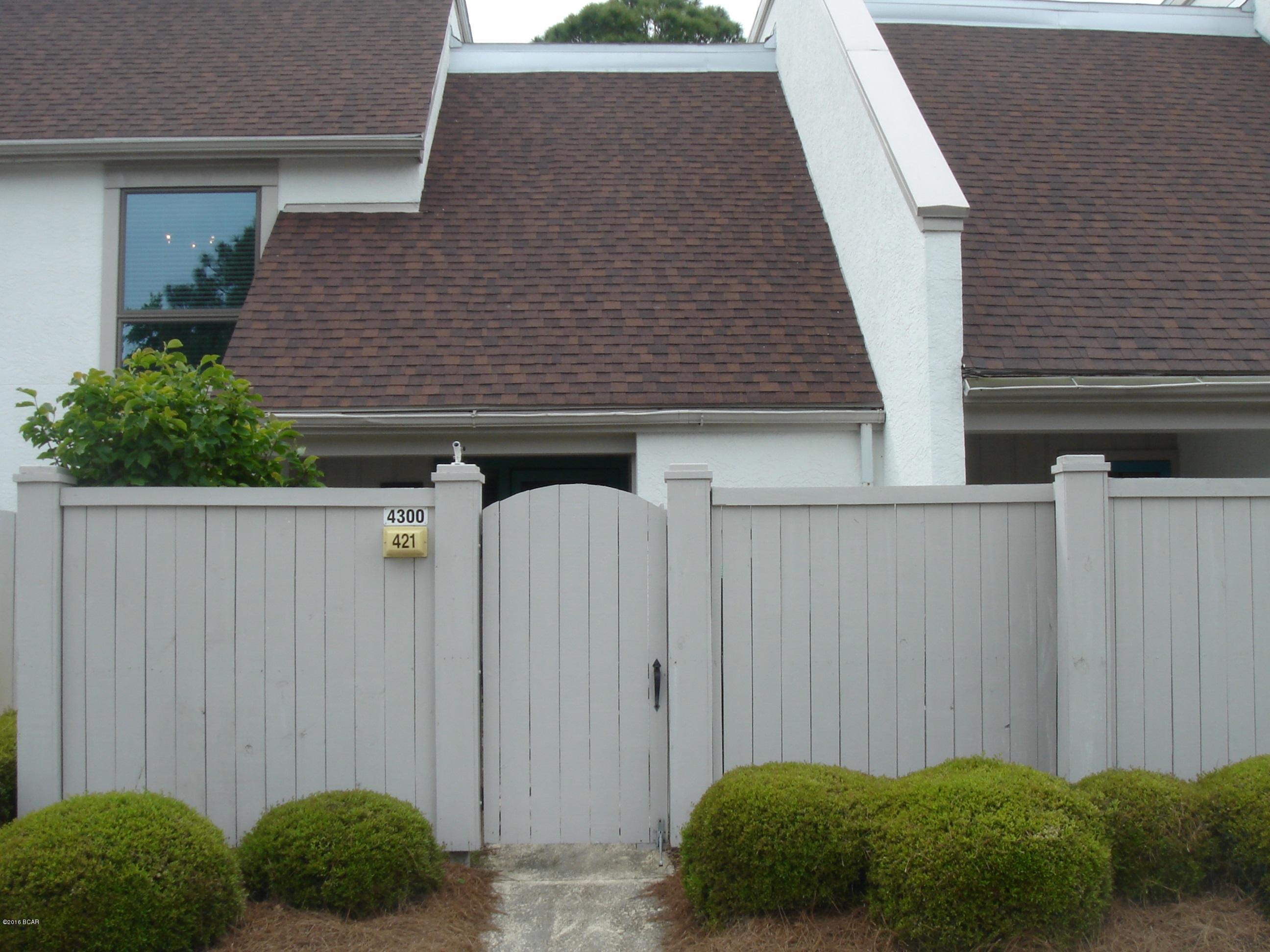 Lovely garden entrance. 21x13 living room has vaulted ceiling and wood burning fireplace.Enclosed 13x10 Florida Room over looking the meadows golf course. Split bedrooms. Guest bedroom has 12x5 Balcony.  Freshly painted and New carpet. There is also a Bay Point HOA fee annually of $1325.00.  Age, SF and room sizes are approximate. Please verify if important.