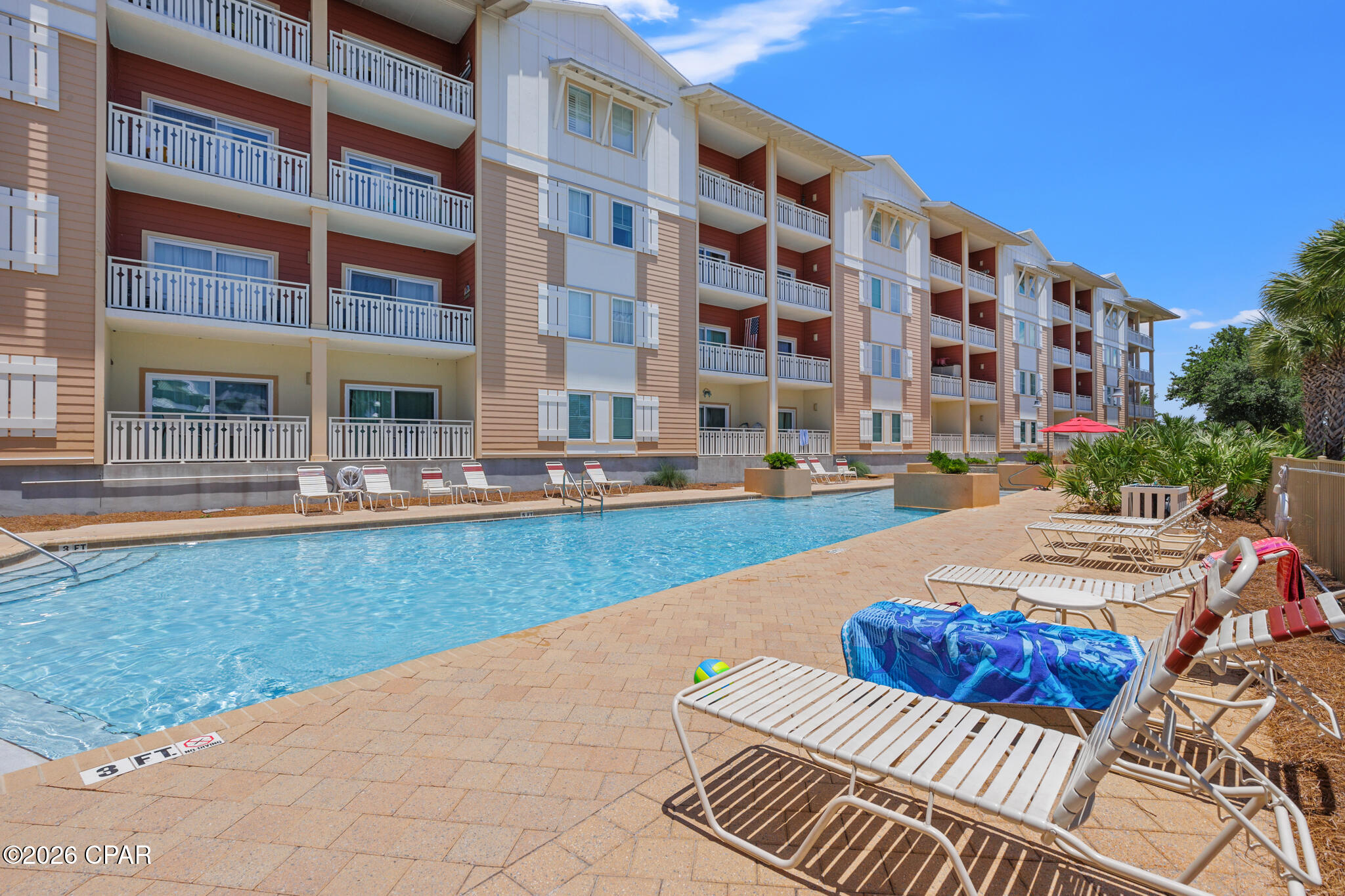 Welcome to easy coastal living in the heart of Mexico Beach! This beautifully maintained first-floor, 3-bedroom, 2-bath condo (Unit 103) offers the ultimate convenience--no waiting on elevators, just walk right in and start enjoying. Inside, you'll find a bright, open-concept layout with durable LVP flooring, neutral coastal tones, and abundant natural light throughout. The spacious living area flows seamlessly to a private covered patio--perfect for morning coffee or evening relaxation--overlooking lush landscaping and peaceful canal-front views. The kitchen and dining area are ideal for entertaining, while all three bedrooms provide comfortable retreats, including a well-appointed primary suite. Offered fully furnished, this unit is truly turnkey and ready for immediate enjoyment or rental income. Step outside and enjoy resort-style amenities including a sparkling community pool, grilling area, and tranquil waterfront setting with charming boardwalks and palm-lined paths. Just a short walk or golf cart ride to the beach, you'll love the convenience of this location. Whether you're searching for a full-time residence, vacation getaway, or income-producing investment, this coastal gem checks all the boxes.