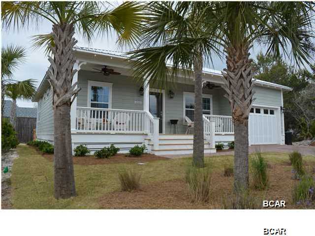 Great Price on a West End PCB beach cottage...Paradise Grove is a gated subdivision with LUSH landscaping, street lights and a resort style pool. This energy efficient home will include Granite, stainless, coastal trim package, upgraded lighting package, bullnose archways, jetted tub, tiled shower and more! Call today to pick your paint colors! Seller is a licensed Realtor. Some options in the photos are paid upgrades.