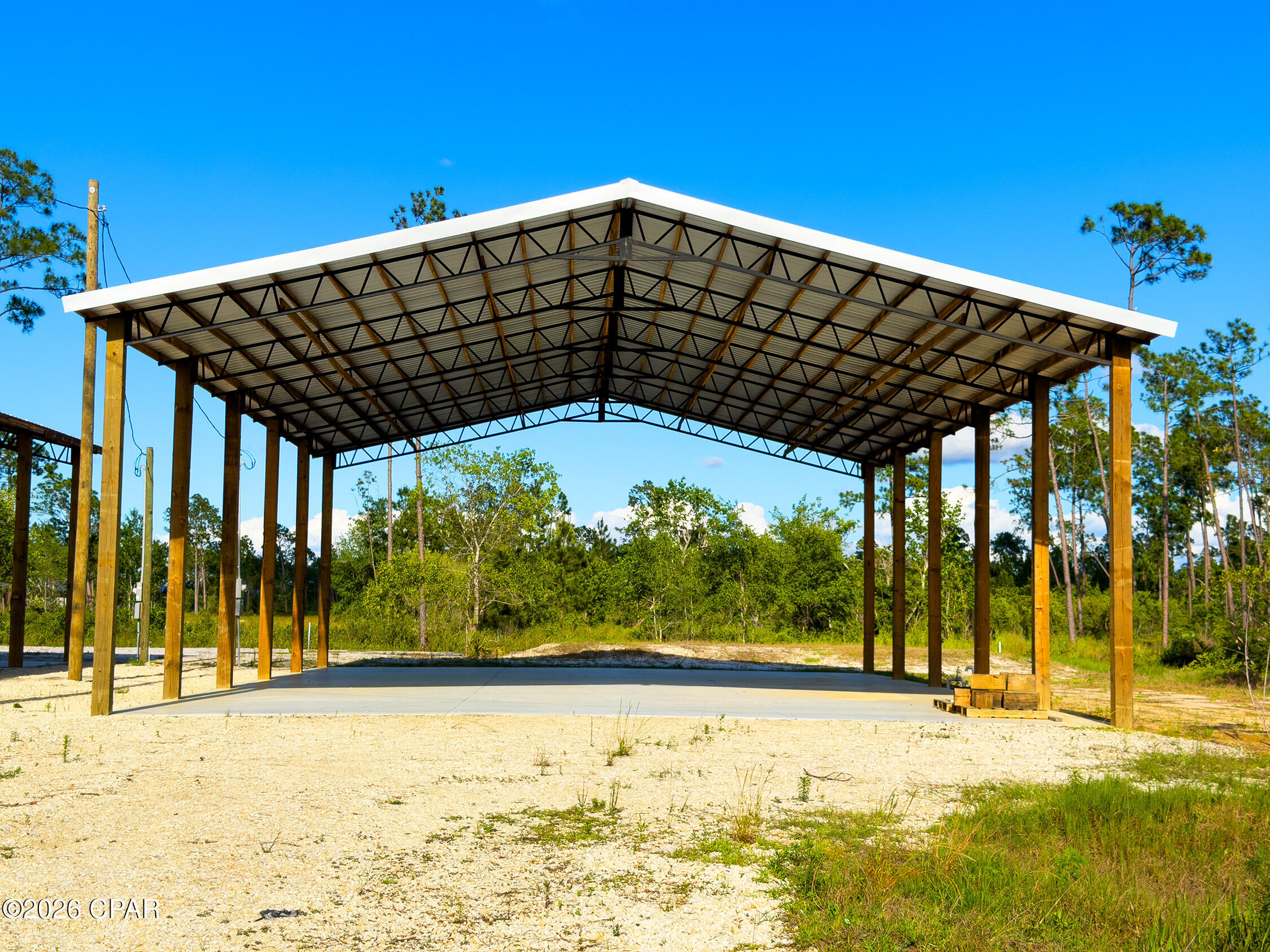 Own Your Piece of Florida's Forgotten Coast. Discover a rare opportunity to purchase a ready to pull in, RV Approved Lot totaling .26 acres here in beautiful Gulf County, Florida. Located just 4 miles from white-sand beaches, world-class fishing, boating, and the laid-back charm of both Mexico Beach and Saint Joe Beach. This improved lot is ideal for Full-time RV living, vacation getaways, and rental income opportunities. The lot has been meticulously finished to include a 40x60 Pole Barn, 6 inch concrete pad, 100 amp service with both 50 amp and 30 amp hookups, brand new septic system, and city water. Located within a mile of the Overstreet Boat Ramp, you can launch your boat onto the Intracoastal Waterway within minutes. Don't miss this opportunity to purchase completed RV Approved lot. *Neighboring parcel is also available as a combined package, see MLS #789923 for details.*