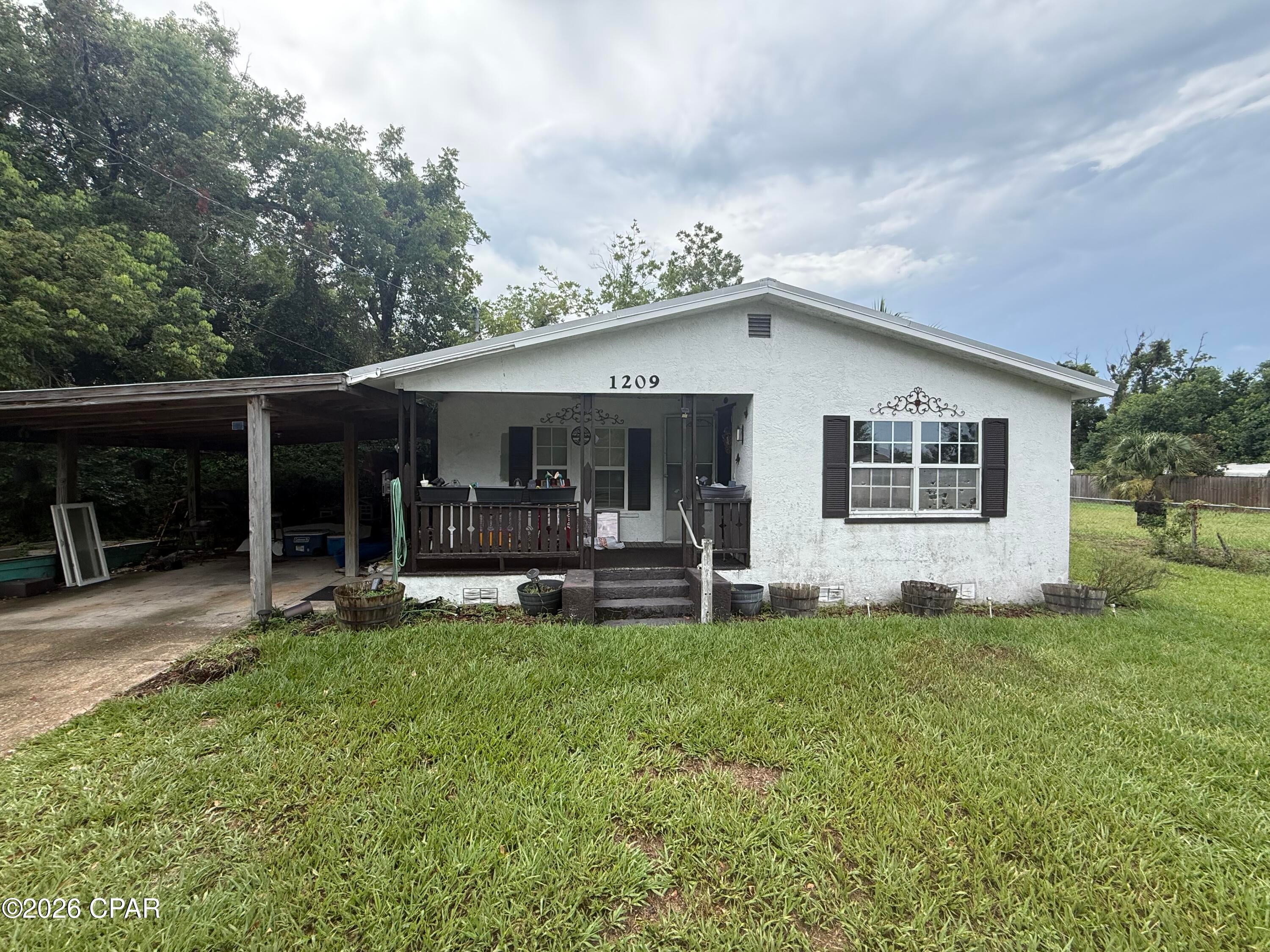Strong value add or BRRRR opportunity in Panama City. This 3 bedroom, 2 bath home offers approximately 1,376 square feet of living space on a .22-acre lot. The layout features a spacious living room, a separate dining area, a convenient flow between rooms and a covered porch, providing a solid starting point for an investor or renovator looking to add value. The property requires renovations, including the roof, HVAC system, electrical system, windows and interior and exterior improvements. The home has been smoked in and is being sold strictly as-is. Title is clean.