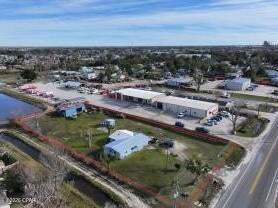 1 Acre Prime Commercial Property with 132' Frontage on N East Ave! Zoned General Commercial 1, this versatile property includes a 3-bedroom, 1.5-bath residence that can easily be converted into office or retail space. Also on-site is a 30'x40' metal building featuring underground electrical and a 400AMP 3-phase circuit panel. Previously used as a fabrication shop, the building remains equipped for industrial or commercial use. The metal building has sustained hurricane damage and will require a new roof. A 10'x12' concrete storage building is also located behind the residence. With convenient access to transportation, a well-dwelling, and a flexible layout, this property offers tremendous potential for development, ideal for a retail plaza, commercial complex, or storage facility. A must-see opportunity for your next business venture!