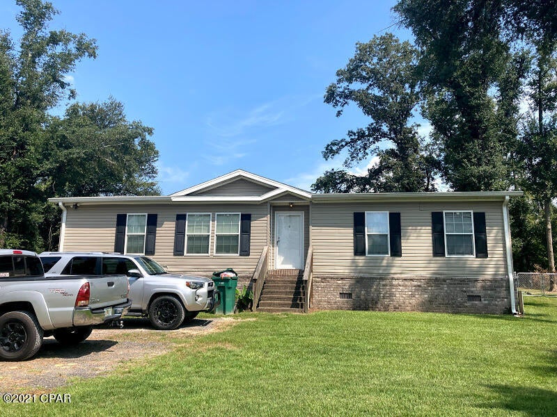 This fantastic home is right across the street from Lake Ocheesee which has some Great Fishing.

A well cared for home with 1644+ sq. ft. 3 beds 2 baths, an office and it is move in ready.

The home features a wonderful split floor plan with an adjacent dining area. The spacious family room is ready for your big screen and sectional.

The master suite features a nice walk in closet and a garden style bath, complete with a soaking tub and dual sinks.

The house has been completely updated with brand new flooring in the kitchen and baths, new carpeting, and tastefully done paint throughout the house.

Entertain on the large back porch overlooking a huge fenced in backyard that has a shed.

Two covered areas for boats and RV so bring the big boy toys!!

Schedule your showing today!!