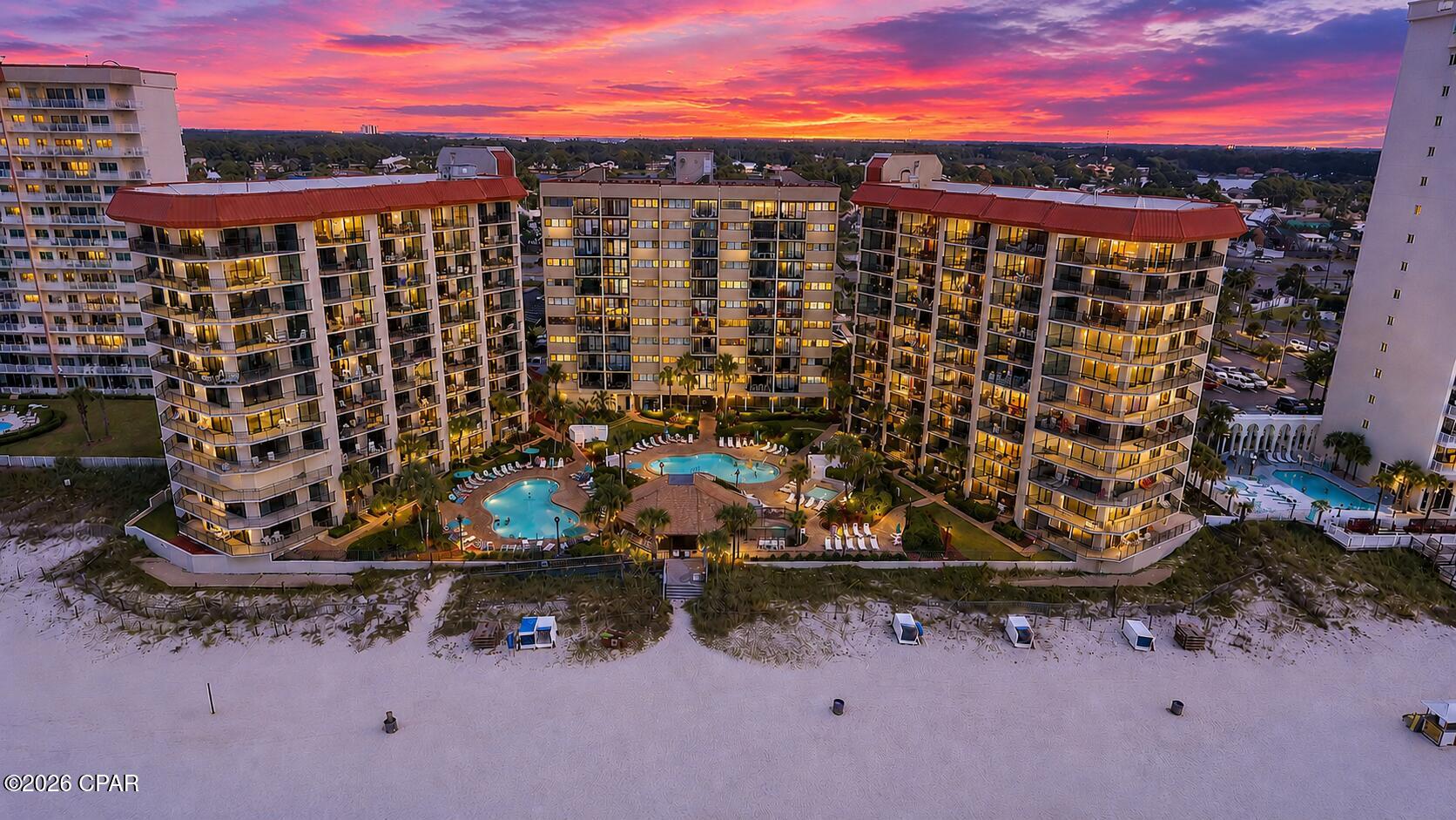 2BR/2BA Gulf-front Summerhouse condo on Thomas Dr. in Panama City Beach. 1,075 SF with Gulf-view balcony, fully furnished and move-in ready. Located on the ninth floor of Summerhouse, a Gulf-front condominium community on Thomas Drive, this residence features updated interior finishes, direct beach access, resort-style amenities, and the added confidence of the building's 2024 Milestone Inspection and Structural Integrity Reserve Study (SIRS) already completed. Whether you're looking for a primary residence, vacation home, or investment property where short-term rentals are permitted, this condominium offers the flexibility today's buyers are seeking.  Designed to maximize its Gulf-front setting, the open living and dining areas flow seamlessly to a private balcony where you can enjoy sweeping beach and Gulf views. The kitchen features updated stainless steel appliances, granite countertops, a breakfast bar, and ample cabinet space. Matching granite countertops in both bathrooms and luxury vinyl plank flooring throughout the entire unit create a clean, cohesive, contemporary look that is also easy to maintain. The split-bedroom floor plan enhances privacy, while the spacious primary suite offers Gulf views and direct balcony access.  This condominium is offered fully furnished and is ready for immediate enjoyment. According to the seller, the unit has not been used as a rental during their ownership, reflecting the care it has received. Monthly HOA dues of $1,212.15 include cable TV, high-speed internet, water, sewer, trash, pest control, insurance, legal services, and professional management, helping simplify ownership.  Situated on approximately 400 feet of Gulf frontage, Summerhouse offers an exceptional collection of resort-style amenities, including two swimming pools, one heated for year-round enjoyment, a beachfront hot tub, kiddie pool, gazebo, barbecue grills, a game room, pickleball, tennis, racquetball, shuffleboard courts, direct beach access, elevators, an on-site convenience store, and professional on-site management.  Located along the desirable Thomas Drive corridor, this Gulf-front community is just minutes from St. Andrews State Park, marinas, charter fishing, diving excursions, waterfront restaurants, grocery stores, shopping, and many of Panama City Beach's most popular attractions. Spend your mornings watching dolphins offshore, your afternoons enjoying the sugar-white sand, and your evenings taking in spectacular sunsets from your private Gulf-front balcony.  If you're searching for a Gulf-front condo in Panama City Beach with direct beach access, updated stainless steel appliances, granite countertops, luxury vinyl plank flooring throughout, resort-style amenities, a completed 2024 Milestone Inspection and Structural Integrity Reserve Study (SIRS), and short-term rentals permitted, this Summerhouse residence presents an outstanding opportunity to own a beautifully maintained beachfront property on Florida's Emerald Coast.