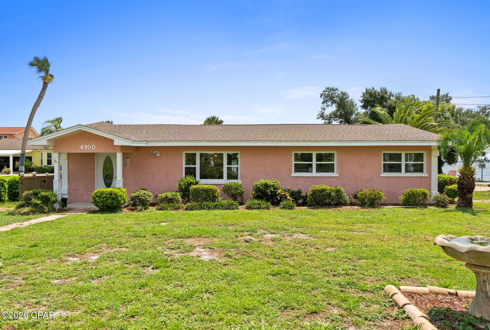 Experience true Florida waterfront living in this beautifully updated 3-bedroom, 2-bath home offering unobstructed views of Parker Bayou at the mouth of Pratt Bayou. Situated on a corner lot at the end of W. Park Street, this charming home blends classic Florida character with modern updates and features water views from most rooms, a spacious family room, Florida room, open kitchen with a stunning 5x10 granite island, custom glass cabinetry, and a large dining area perfect for entertaining. Outside, enjoy your private 40-foot dock, private beach, and direct access to the bay for boating, fishing, paddleboarding, or a quick ride to Shell Island or Bayou Joe's. Watch dolphins and pelicans from your backyard while taking in spectacular sunsets. Conveniently located near parks with pickleball and tennis courts, shopping, dining, schools, Tyndall Air Force Base, Northwest Florida Beaches International Airport, and just 30 minutes from Panama City Beach, this exceptional waterfront property is ideal as a primary residence, second home, or vacation getaway.